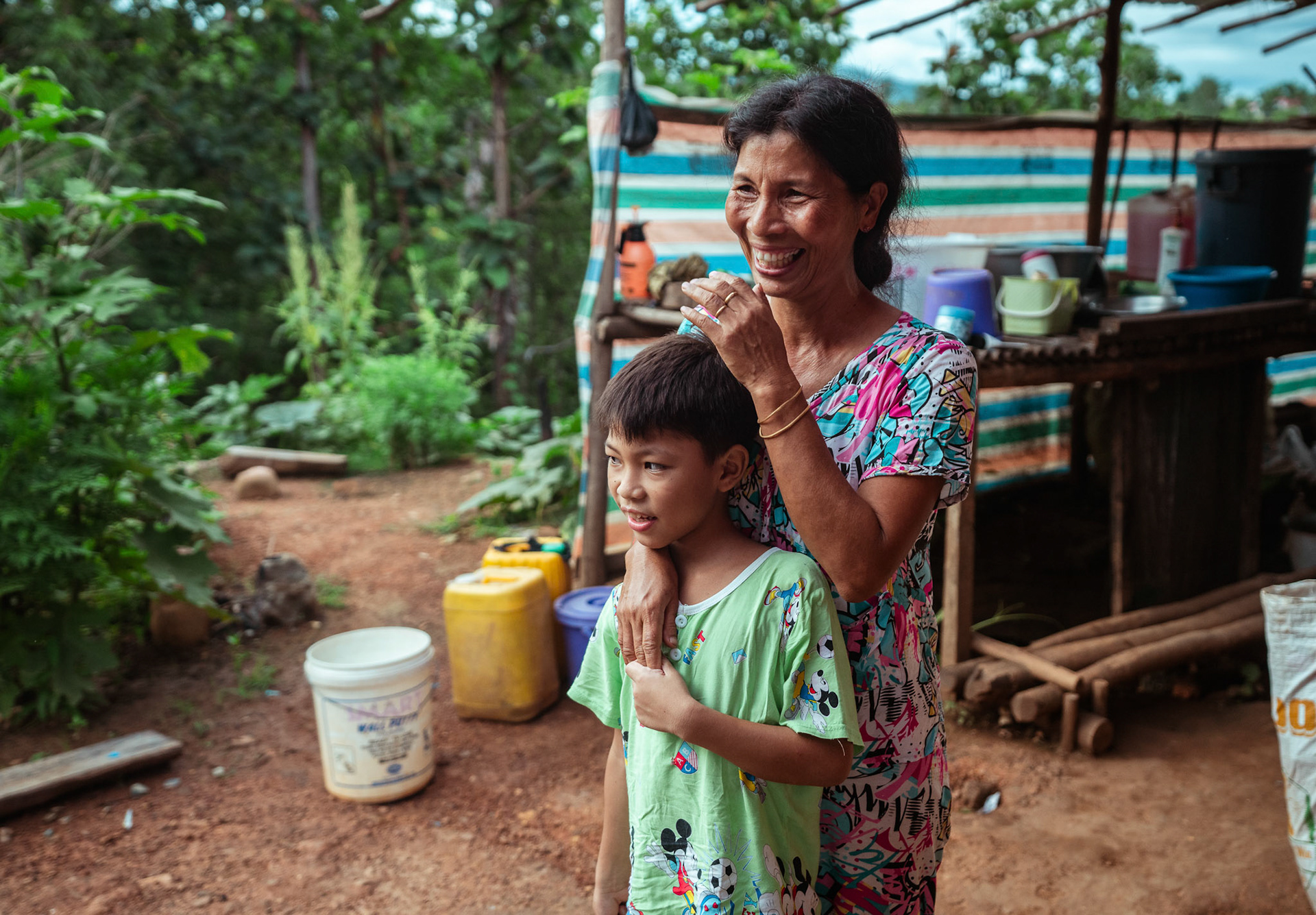 A refugee mother with her child in front of their house in Moreh, Manipur, captured during the COVID recovery program organised by Catholic Relief Services (CRS).