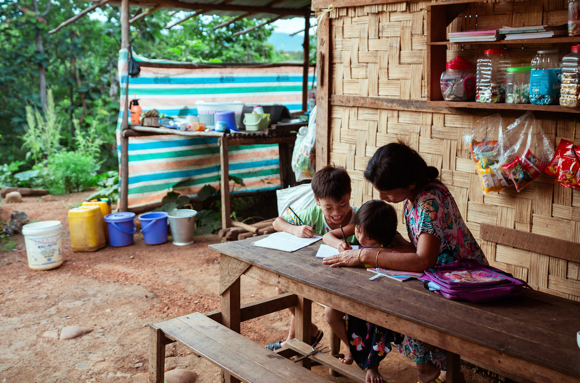 Mothers tutoring their children after attending skill development and adult education modules organised by members of CRS in Moreh, Manipur.