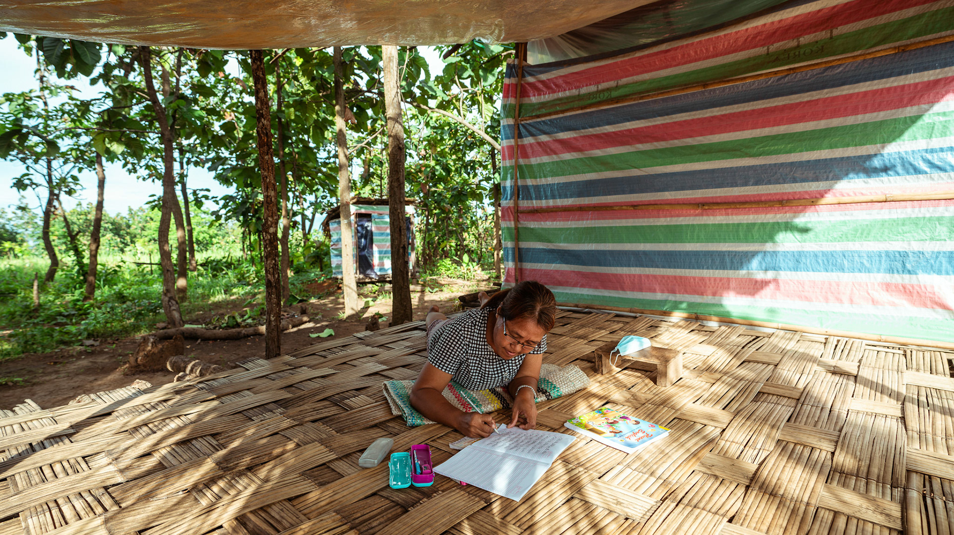 A refugee in Moreh, Manipur, doing her homework as part of the Adult education initiative organised by CRS as a part of COVID-19 Response and Recovery Program.