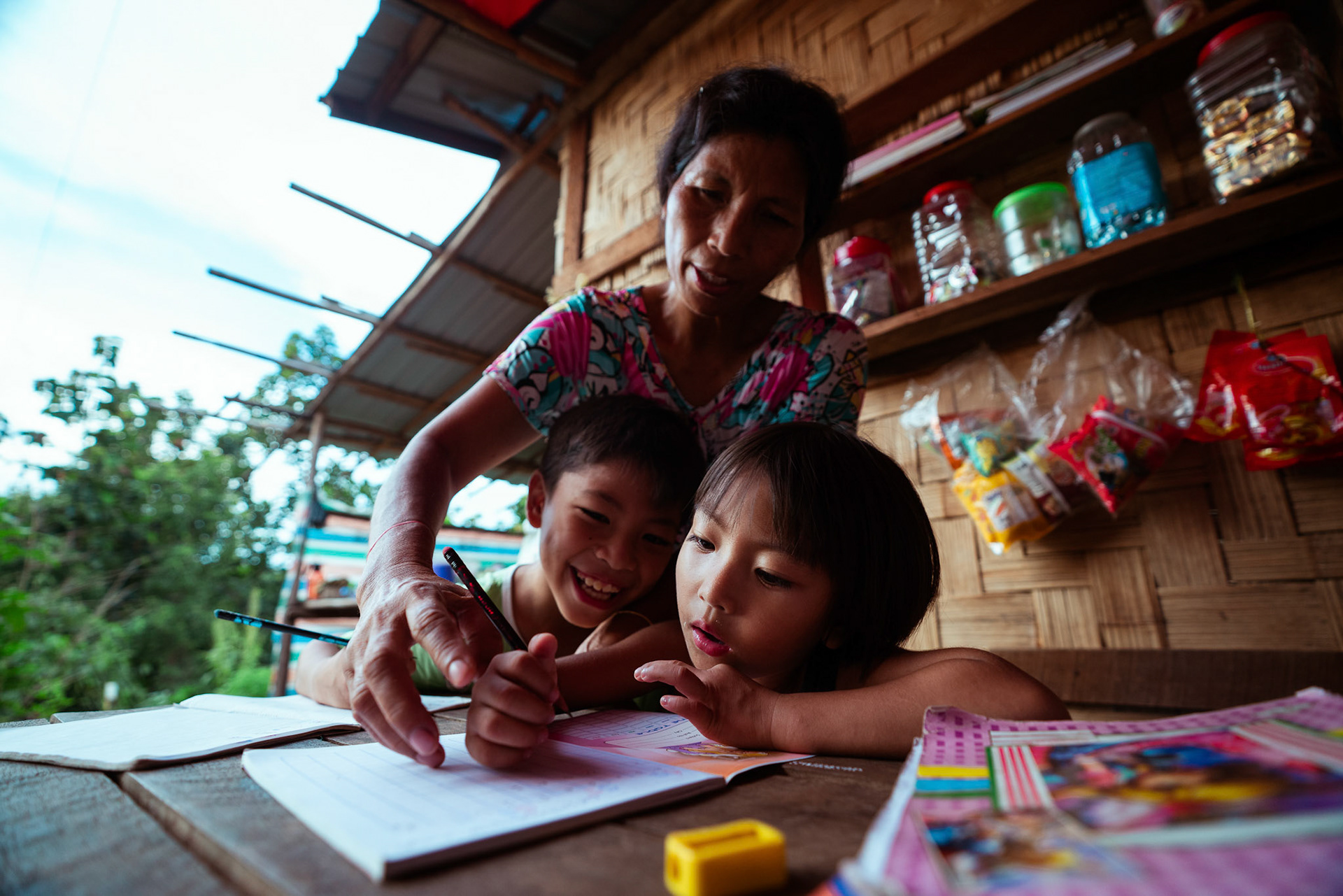 Mothers tutoring their children after attending skill development and adult education modules organised by members of CRS in Moreh, Manipur.