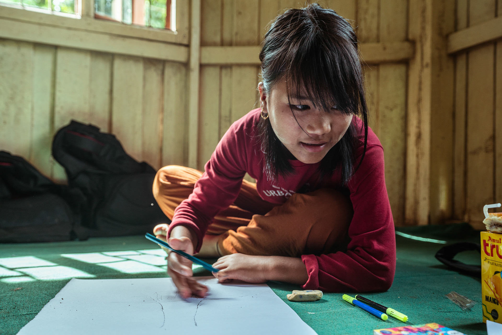 Refugee children during the 'Tree of life' sessions organised by Catholic Relief Services (CRS) in Moreh, Manipur.The “Tree of Life” is a psychosocial support tool based on narrative practices that is designed to help participants accept the hardships of their past and identify the strengths that can help them a