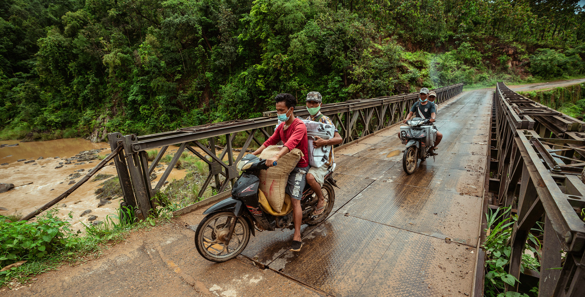 A group of refugees in Moreh, Manipur, carrying basic needs supplies back to thier homes after the Voucher Based Distribution of basic need supplies and COVID recovery kits among People of Concern (POC) in Moreh, Manipur organised by Catholic Relief Services (CRS)