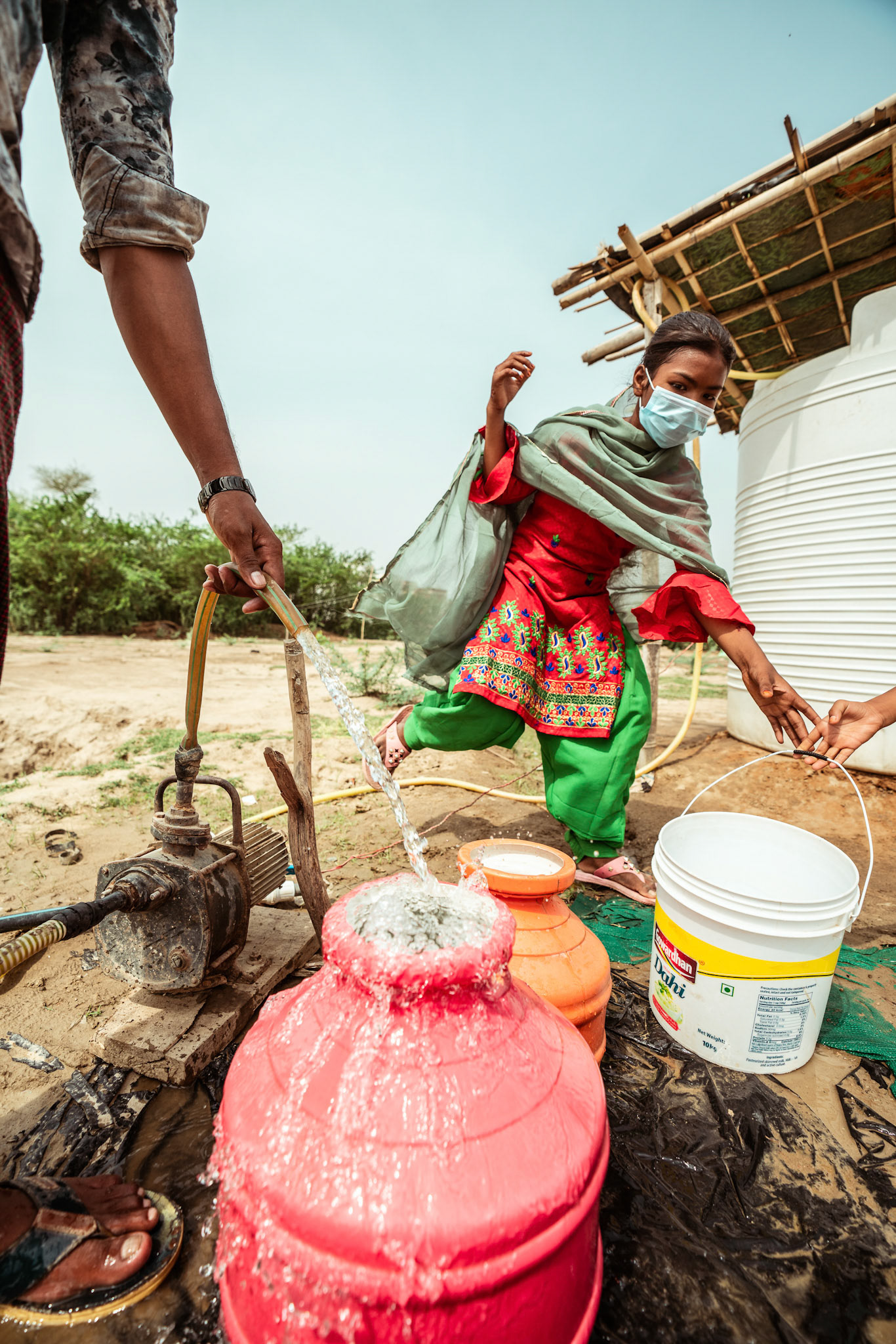 Rohingya Refugees in Mewat, Haryana, at the pum installed under the COVID-19 Response and Recovery Program organised by Catholic Relief Services (CRS).