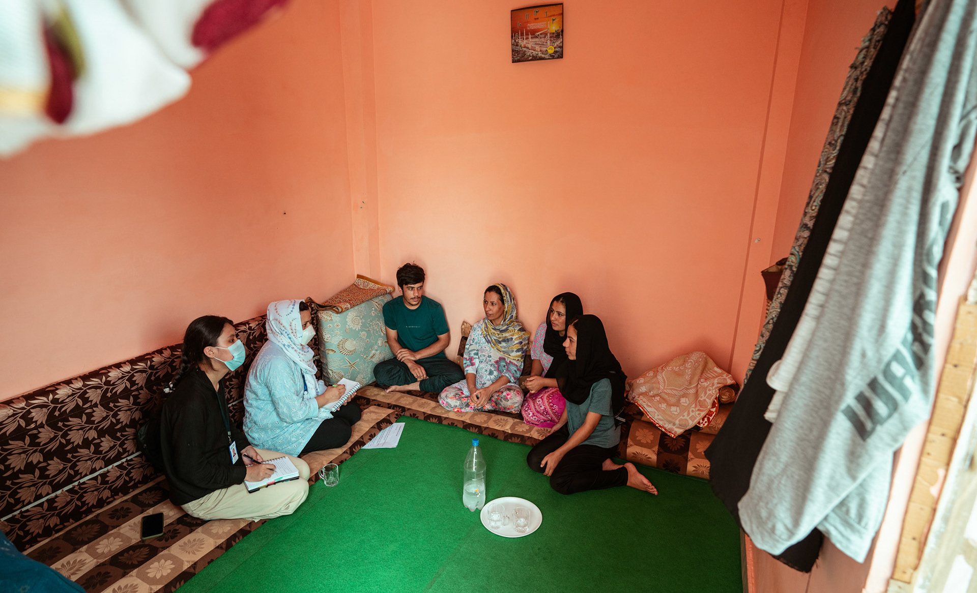 Representatives of Jesuit Relief Services (JRS) educating refugees in Tilak Nagar, Delhi about COVID Appropriate Behaviour, Gender based violence and child protection  under the Catholic Relief Services (CRS) refugee initiative.