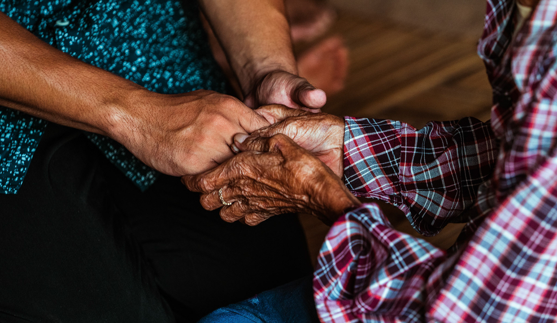 A doctor comforting a senior citizen during consultation at a medical camp in Moreh, Manipur, organised for refugees by Catholic Relief Services (CRS).