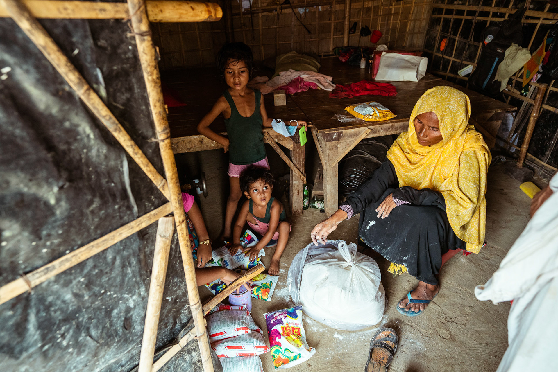 Beneficiaries collecting basic need supplies and COVID recovery kits being distributed by Catholic Relief Services (CRS) as a part of COVID-19 Response and Recovery Program in Mewat, Haryana.