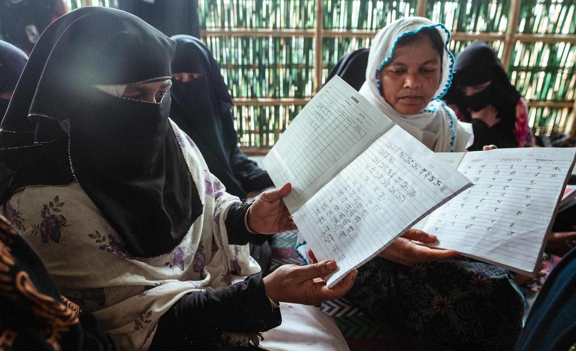 Rohingya refugee women studying in Mewat, Haryana, at a language learning centre organised by members of Catholic Relief Services (CRS).
