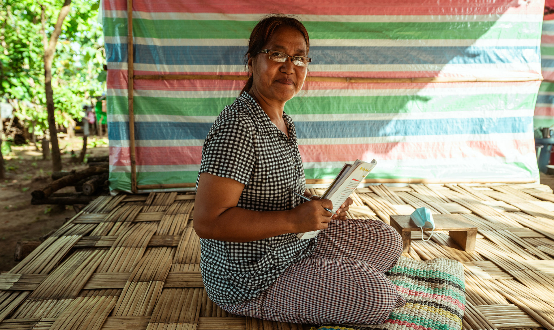 A refugee in Moreh, Manipur, doing her homework as part of the Adult education initiative organised by CRS as a part of COVID-19 Response and Recovery Program.