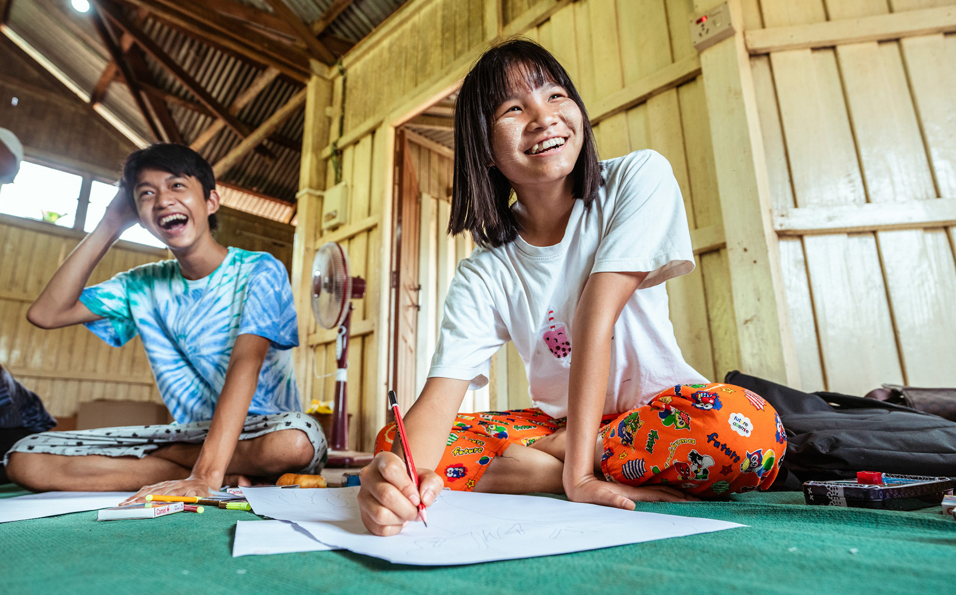 Refugee children during the 'Tree of life' sessions organised by Catholic Relief Services (CRS) in Moreh, Manipur.The “Tree of Life” is a psychosocial support tool based on narrative practices that is designed to help participants accept the hardships of their past and identify the strengths that can help them a