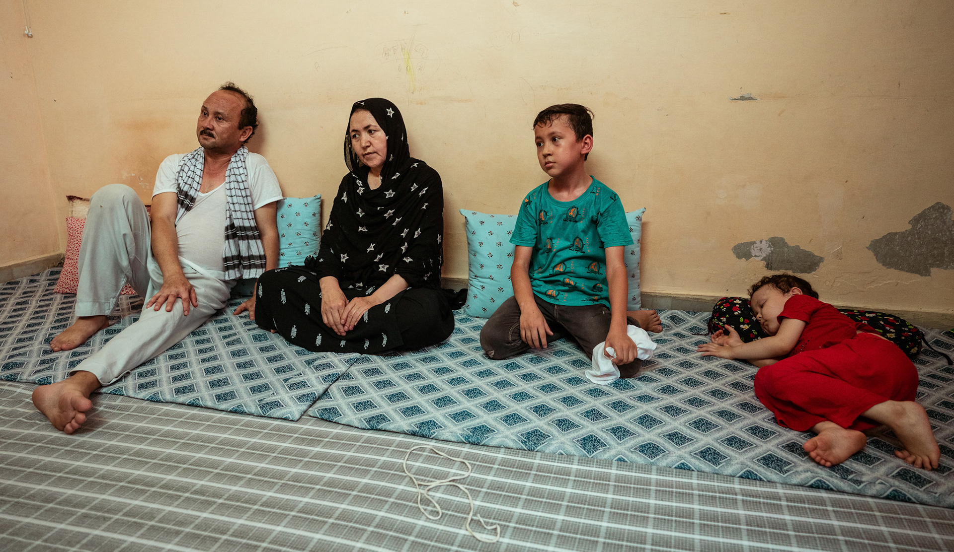 Afghan refugees listen as representatives of Jesuit Relief Services (JRS) in Tilak Nagar, Delhi share information  about COVID Appropriate Behaviour, Gender based violence and child protection  under the Catholic Relief Services (CRS) refugee initiative.