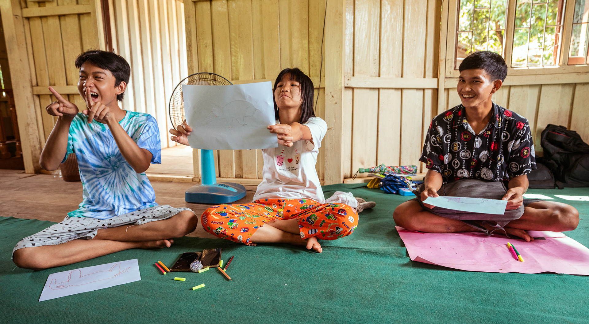 Refugee children during the 'Tree of life' sessions organised by Catholic Relief Services (CRS) in Moreh, Manipur.The “Tree of Life” is a psychosocial support tool based on narrative practices that is designed to help participants accept the hardships of their past and identify the strengths that can help them a