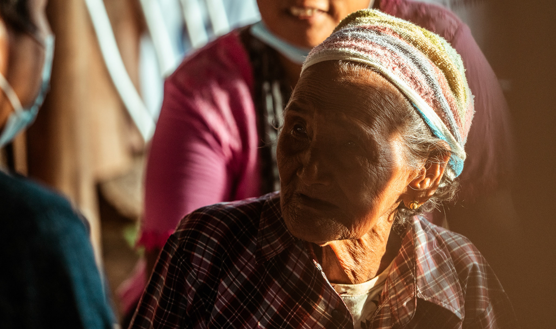 A senior citizen consulting the doctor at a medical camp in Moreh, Manipur, organised for refugees by Catholic Relief Services (CRS).