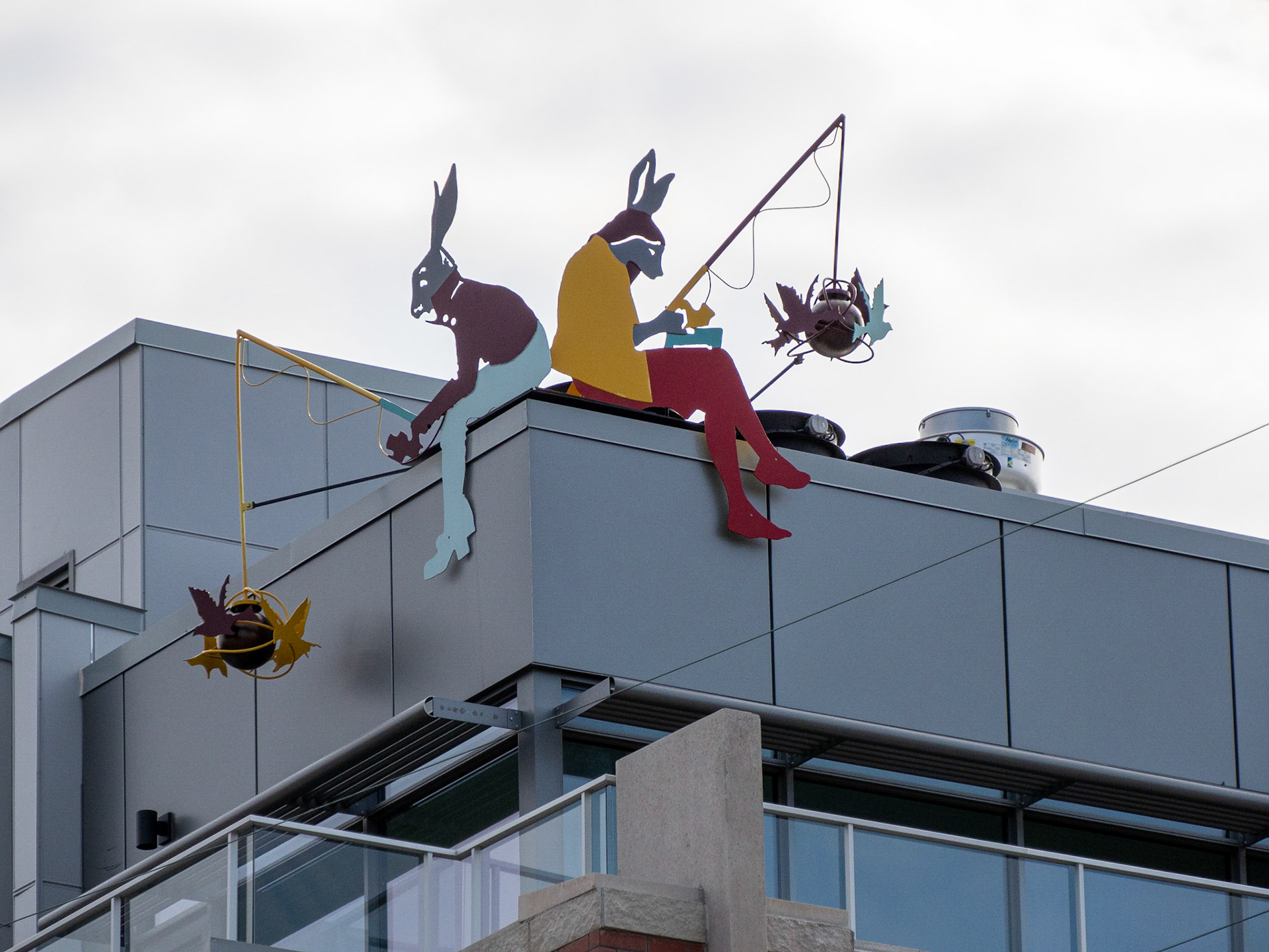 fishing from rooftop sculpture