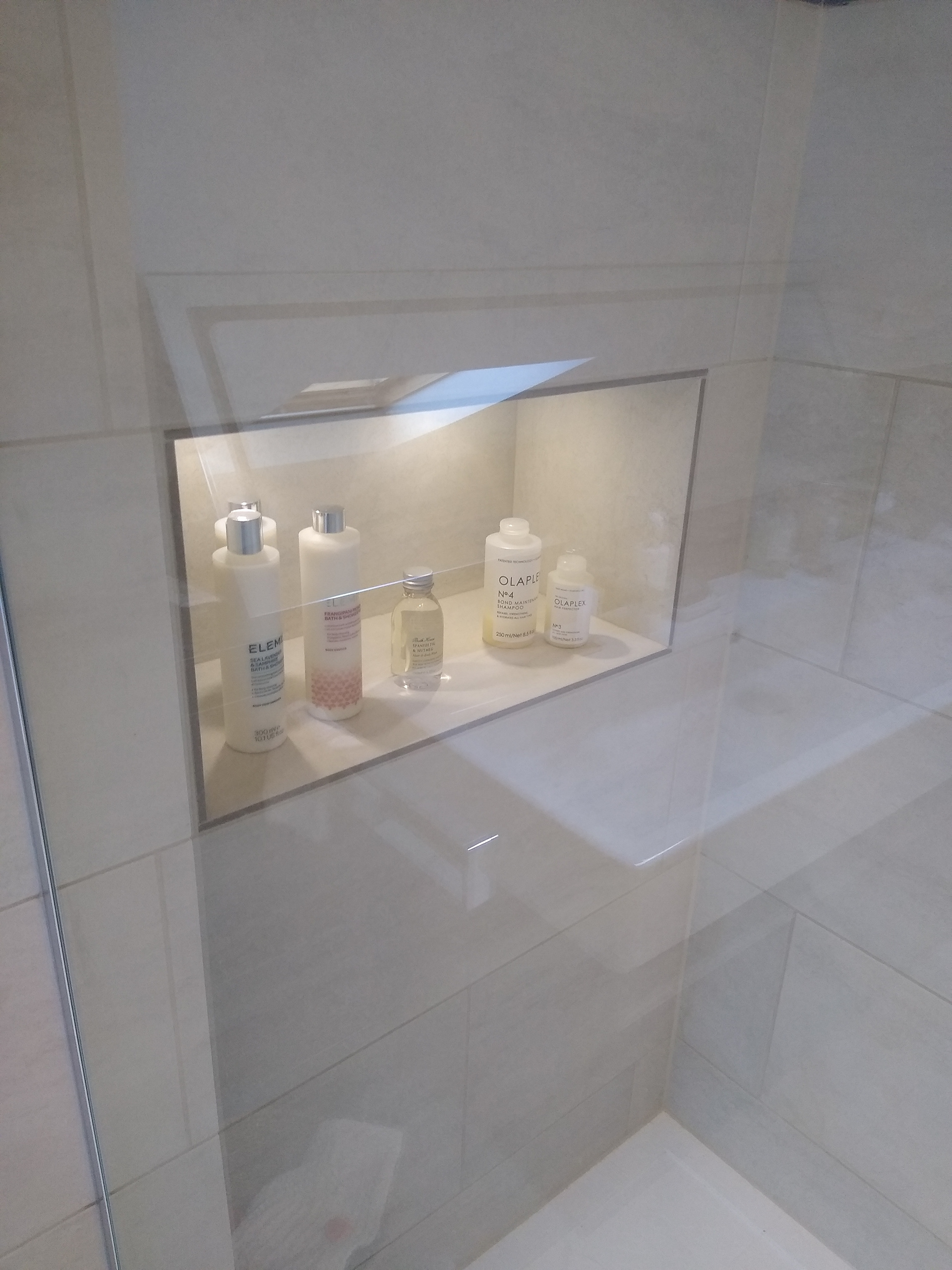 A shower niche with built in lighting
