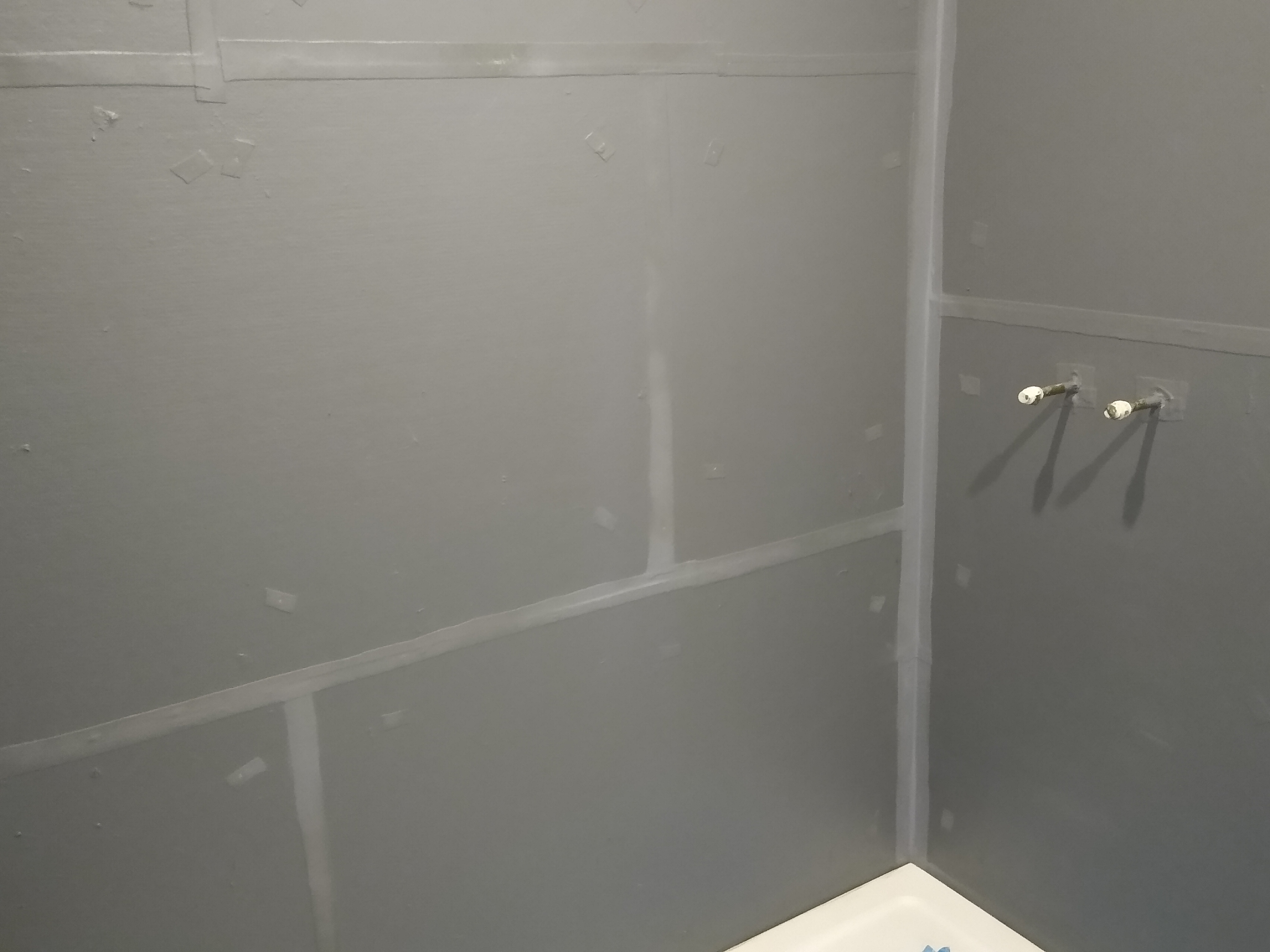 All joints sealed and a waterproof tanking membrane applied to the shower area