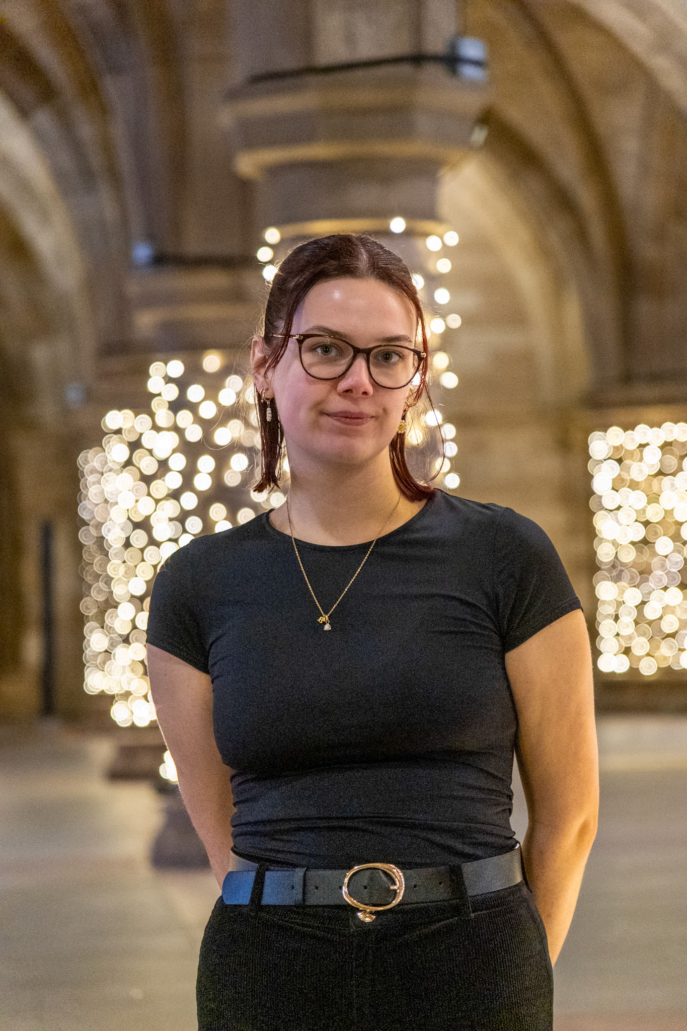 Portrait of a woman with the University of Glasgow cloisters in the background