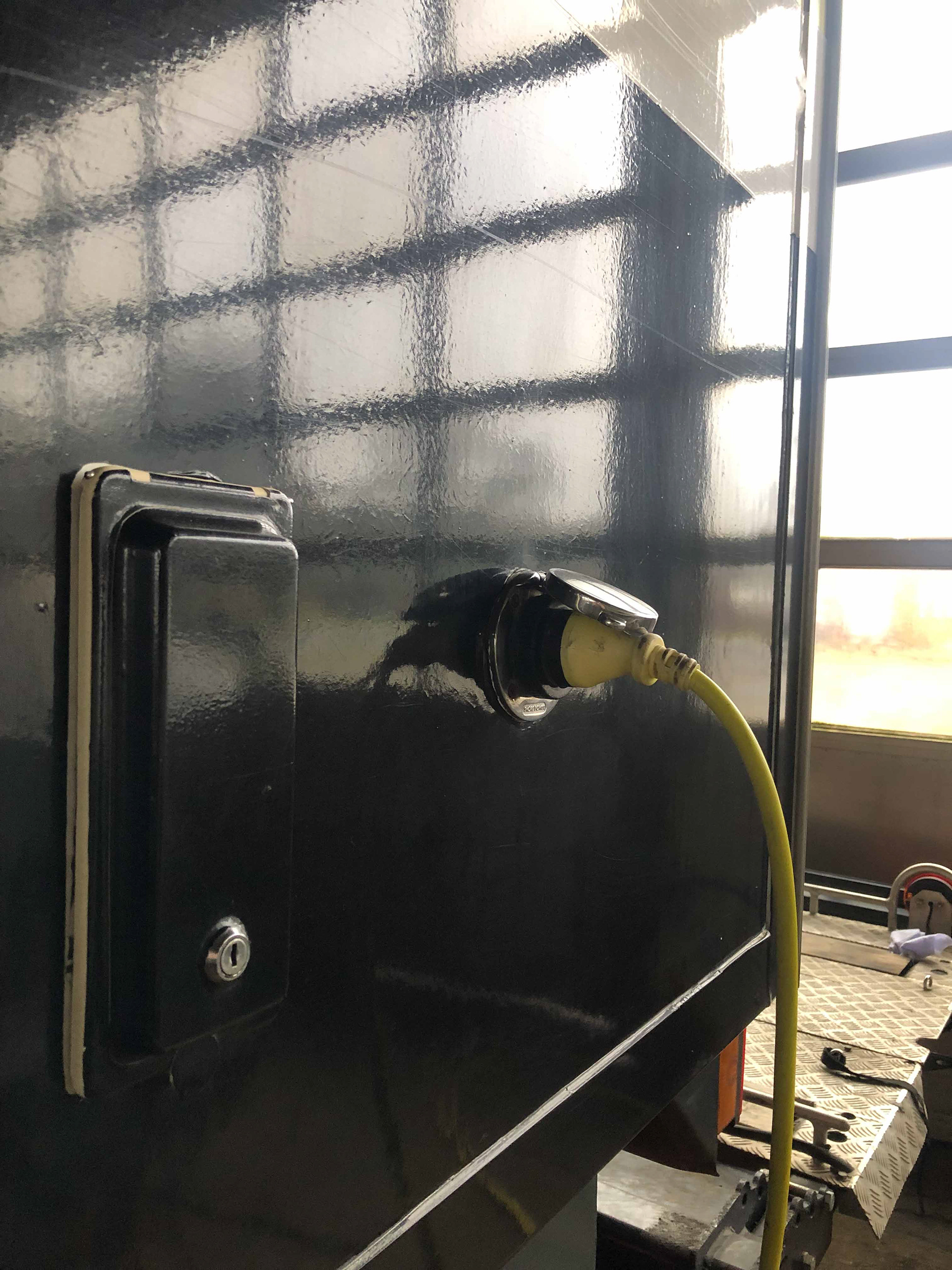 Outdoor shower access and shore power