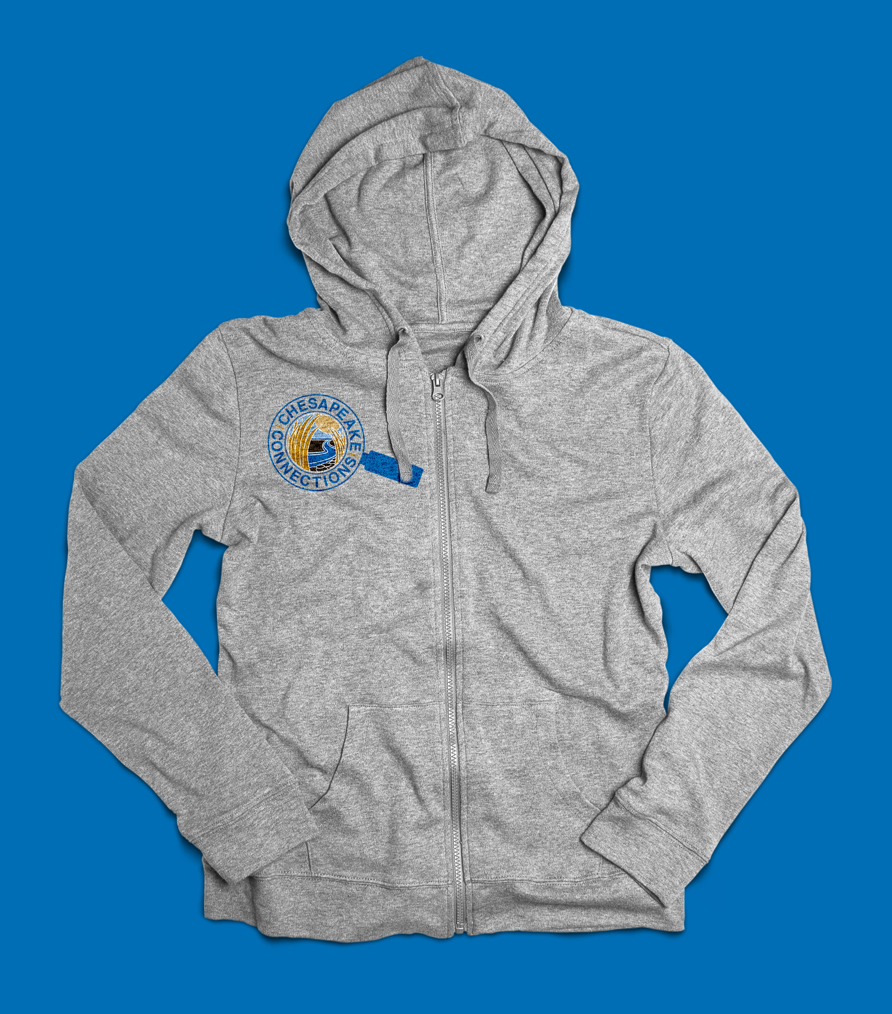 A grey kids hoodie sitting on a blue background. The hoodie has the color Chesapeake Connections logo printed on the upper left side.
