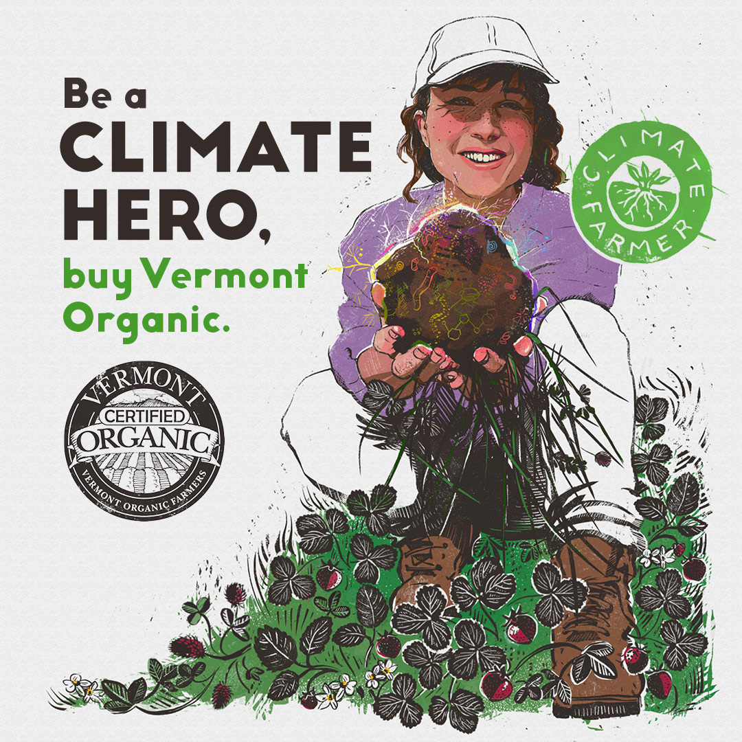 A self portrait of a smiling woman holding up a clump of soil teeming with colorful life.