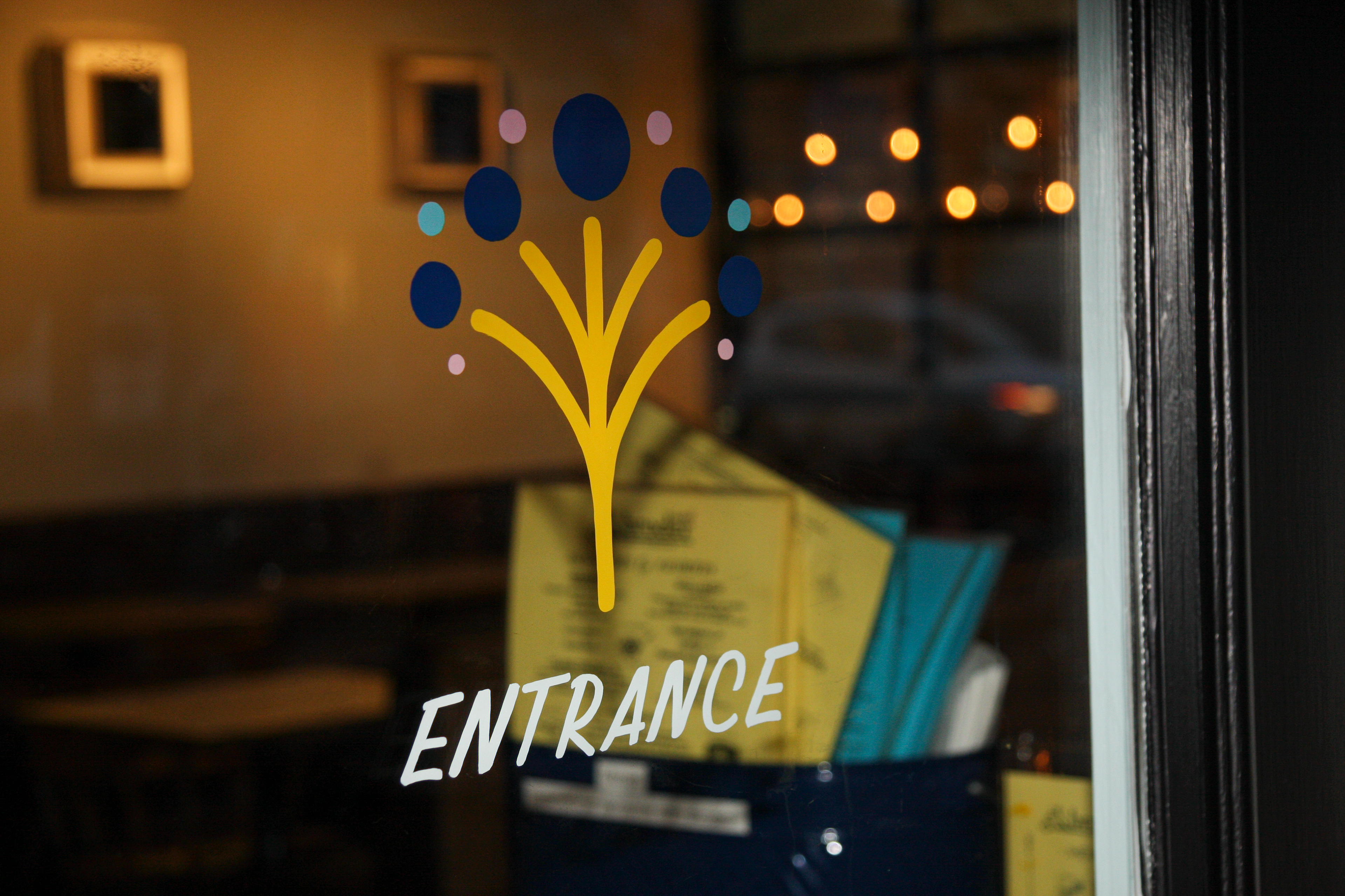 Reverse painted logo and wayfinding text.