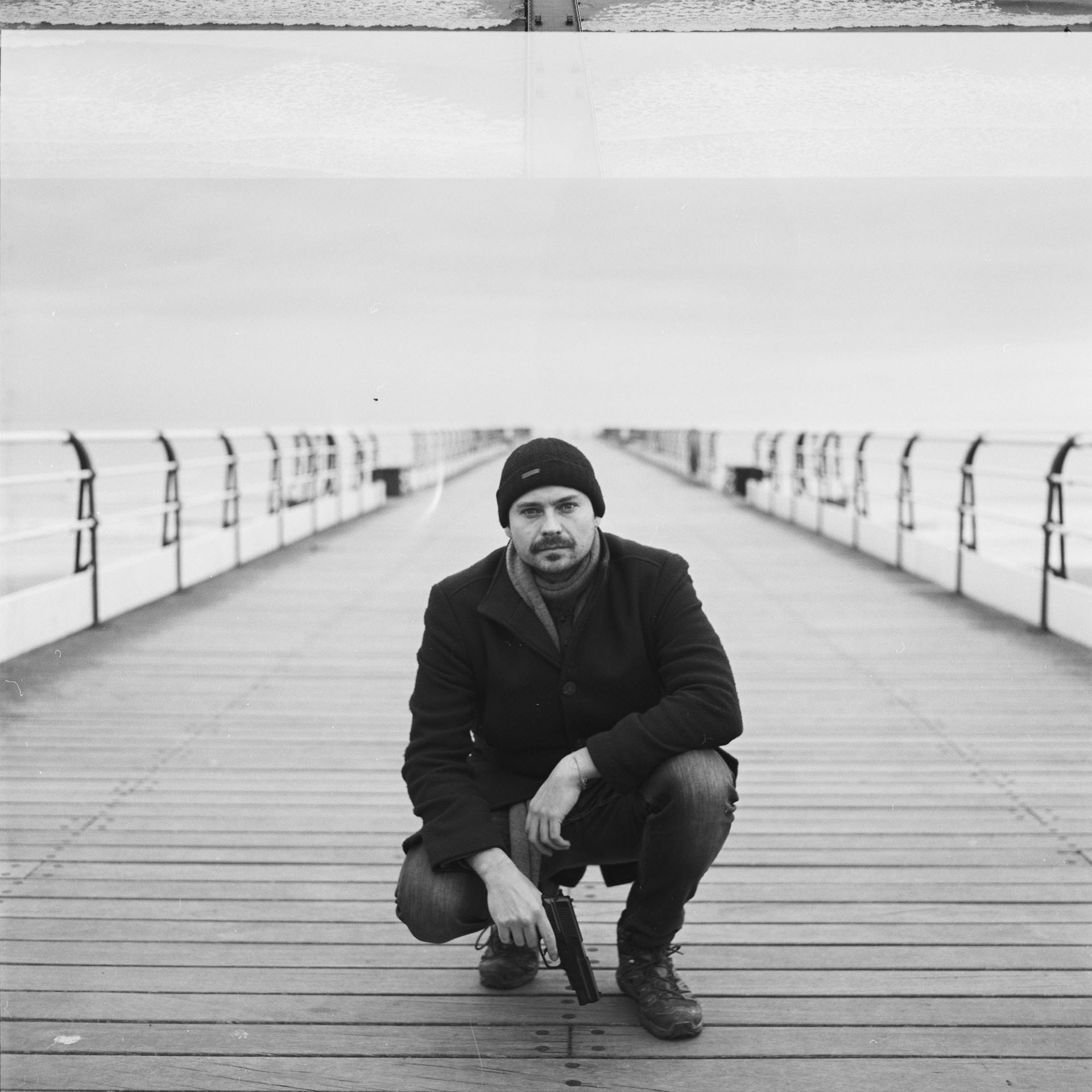 Robin on set with the prop gun