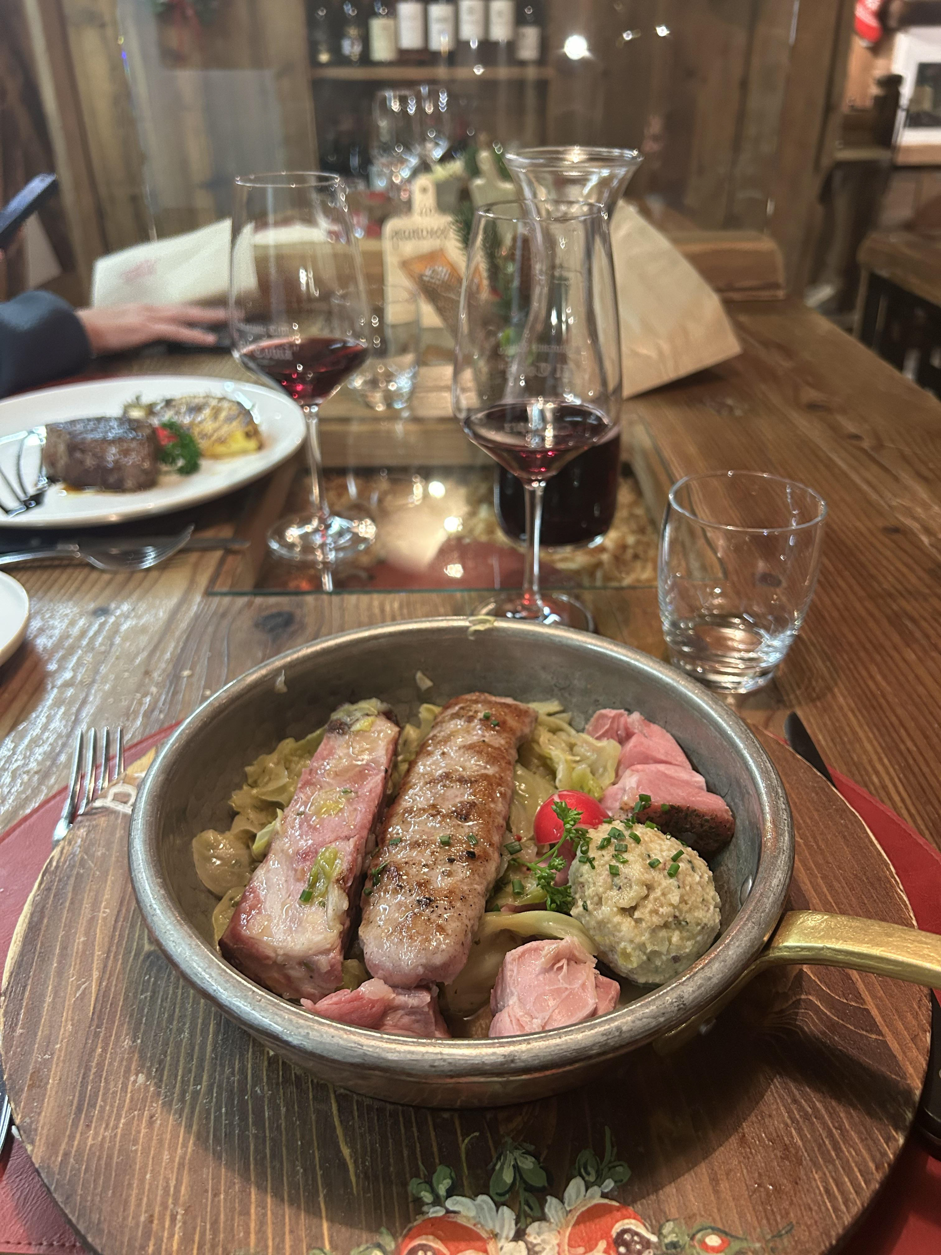 Sydney Grill served me (canederli dumplings with speck, braised savoy cabbage, pork rib, smoked pork shank and locally-produced luganica sausage)