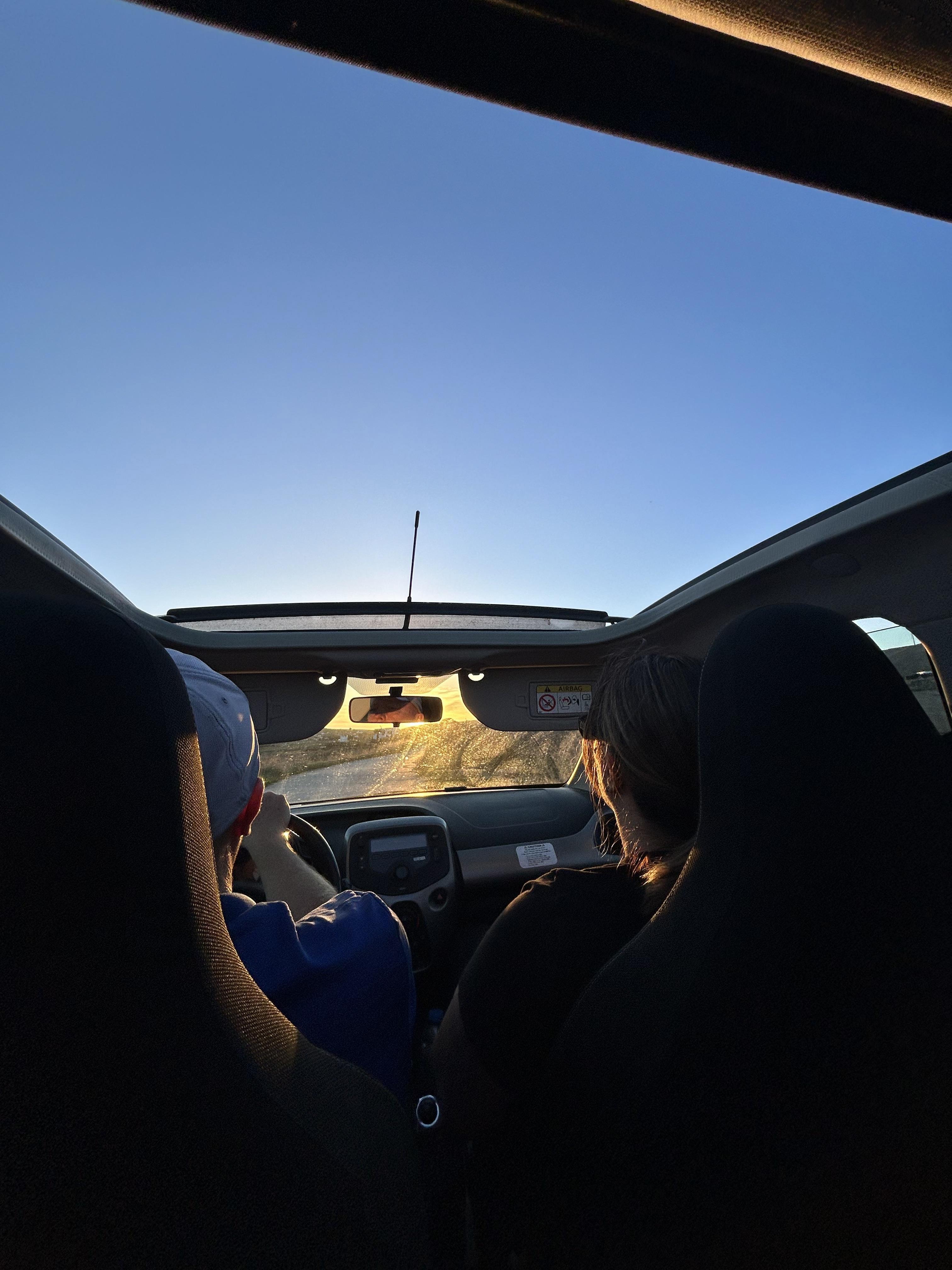 Driving around Paros, crashing someones bbq and reversing down a hill. 