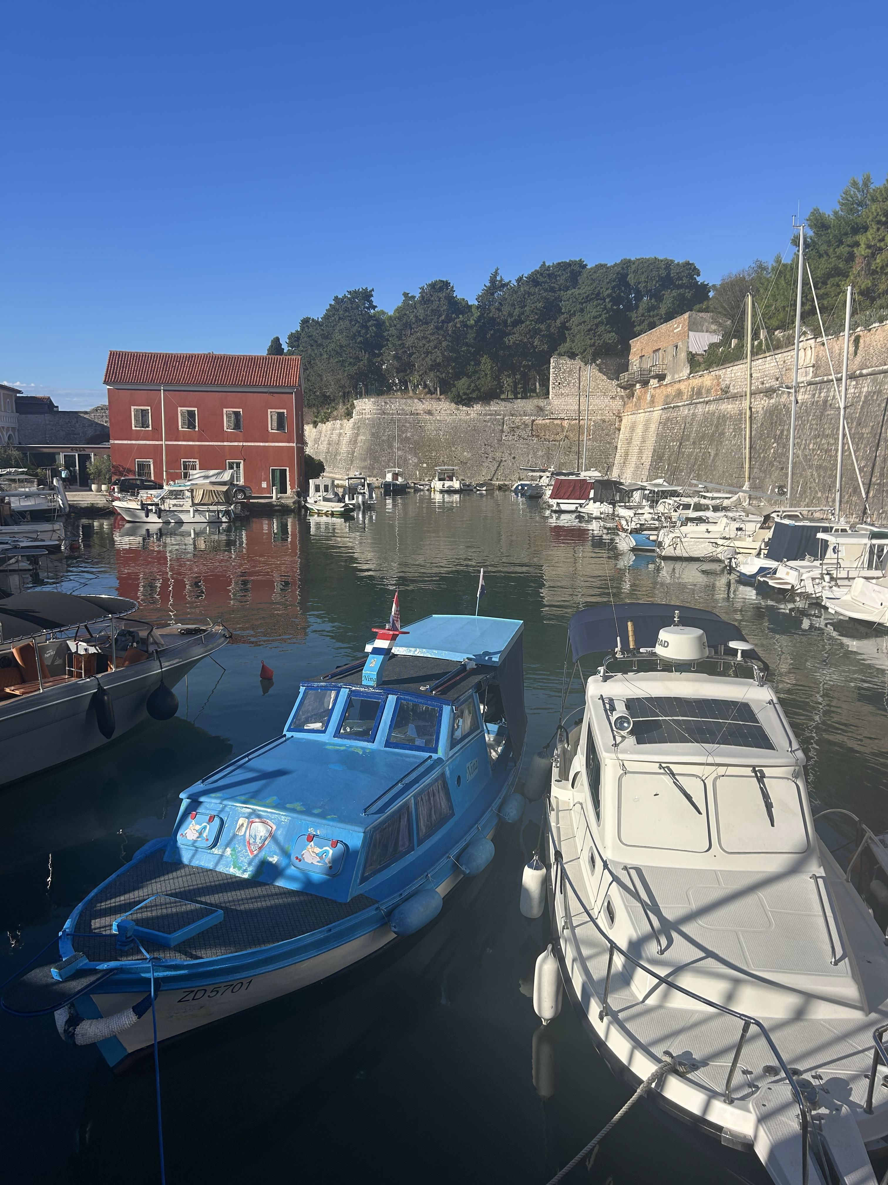 I wish I was the guy painting the blue boat before you get into Old Town Zadar