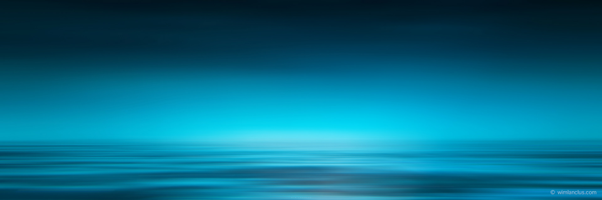 blue panorama of blurry ocean waves and sky
