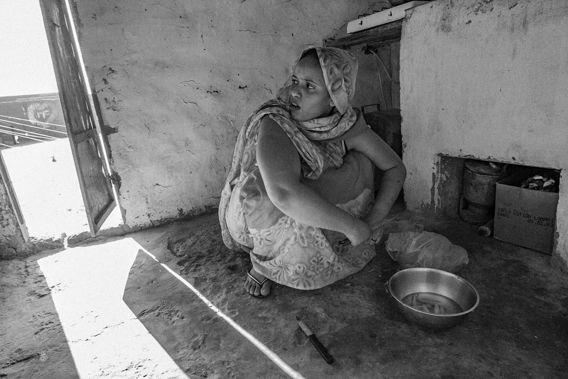 Dakhla refugee camp, Tindouf, Wilaya de Tindouf, Algerian Sahara, 2009: Woman preparing food in the kitchen of her house.