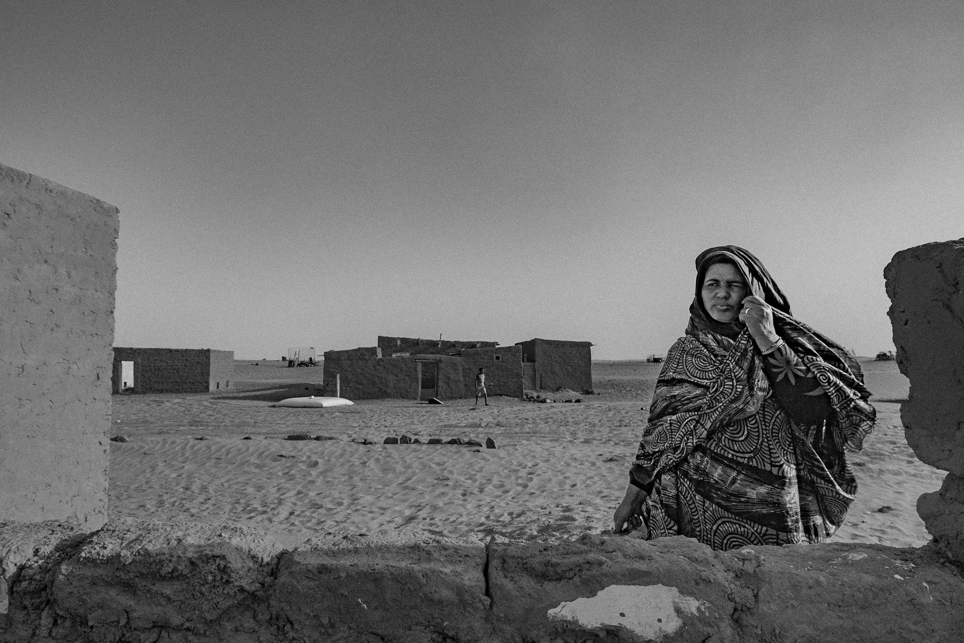 Dakhla refugee camp, Tindouf, Wilaya de Tindouf, Algerian Sahara, 2009: Woman waiting in front of her house.