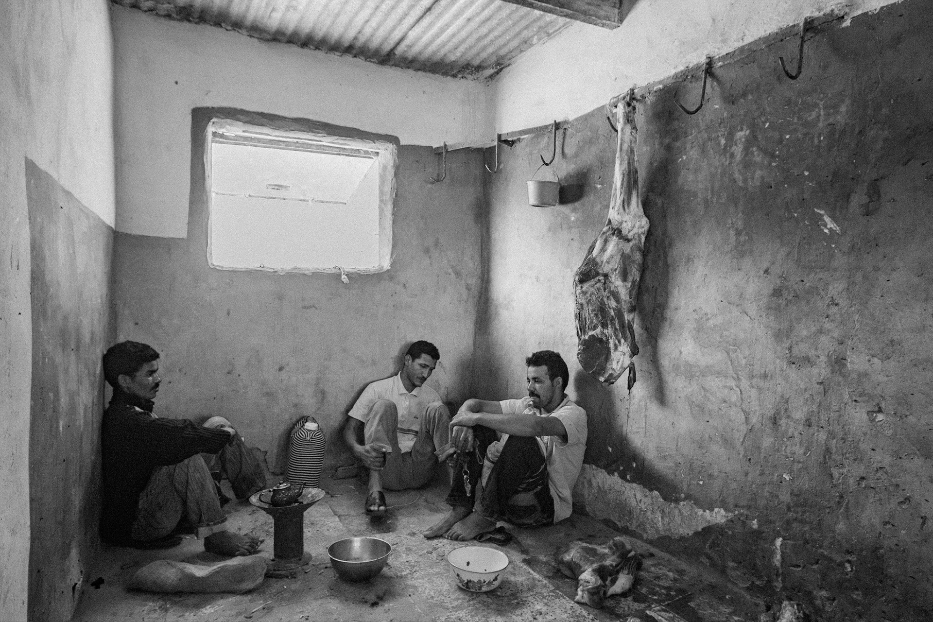 Dakhla refugee camp, Tindouf, Wilaya de Tindouf, Algerian Sahara, 2009: Having tea in the backroom of the butcher shop.