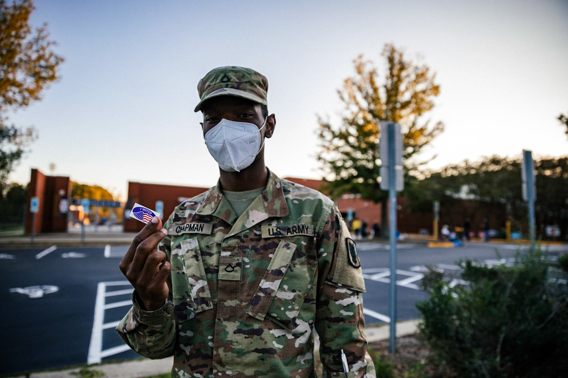 US Army Private First Class Chapman showing his sticker after voting in Southeast Raleigh High School in Raleigh, North Carolina, USA, 03 November 2020. Americans vote on Election Day to choose between re-electing Donald J. Trump or electing Joe Biden as the 46th President of the United States to serve from 2021 through 2024.