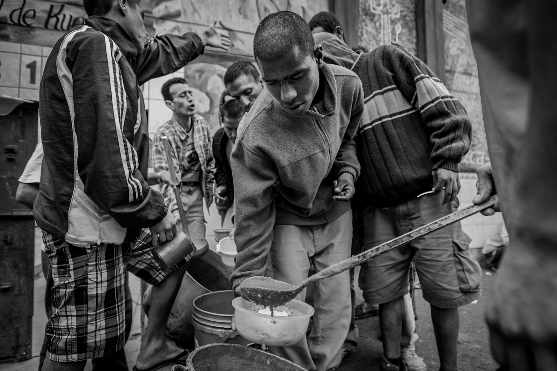 LURIGANCHO PENITENTIARY, SAN JUAN DE LURIGANCHO, LIMA, PERU: Inmates with fewer resources and who cannot afford their own food receive a ration of leftover food from each cellblock.
