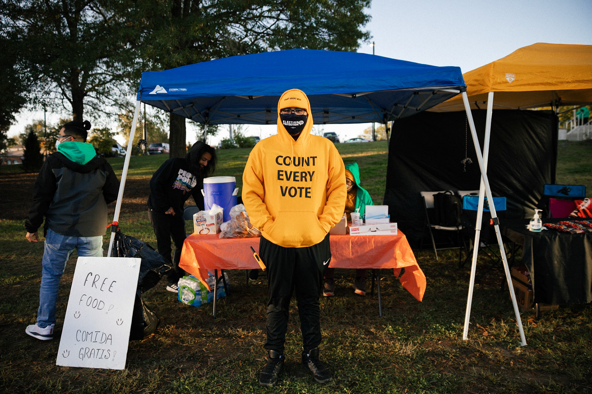 Volunteers hand out free food and drinks to voters outside Durham County Library in Durham, North Carolina, USA, 03 November 2020. Americans vote on Election Day to choose between re-electing Donald J. Trump or electing Joe Biden as the 46th President of the United States to serve from 2021 through 2024.