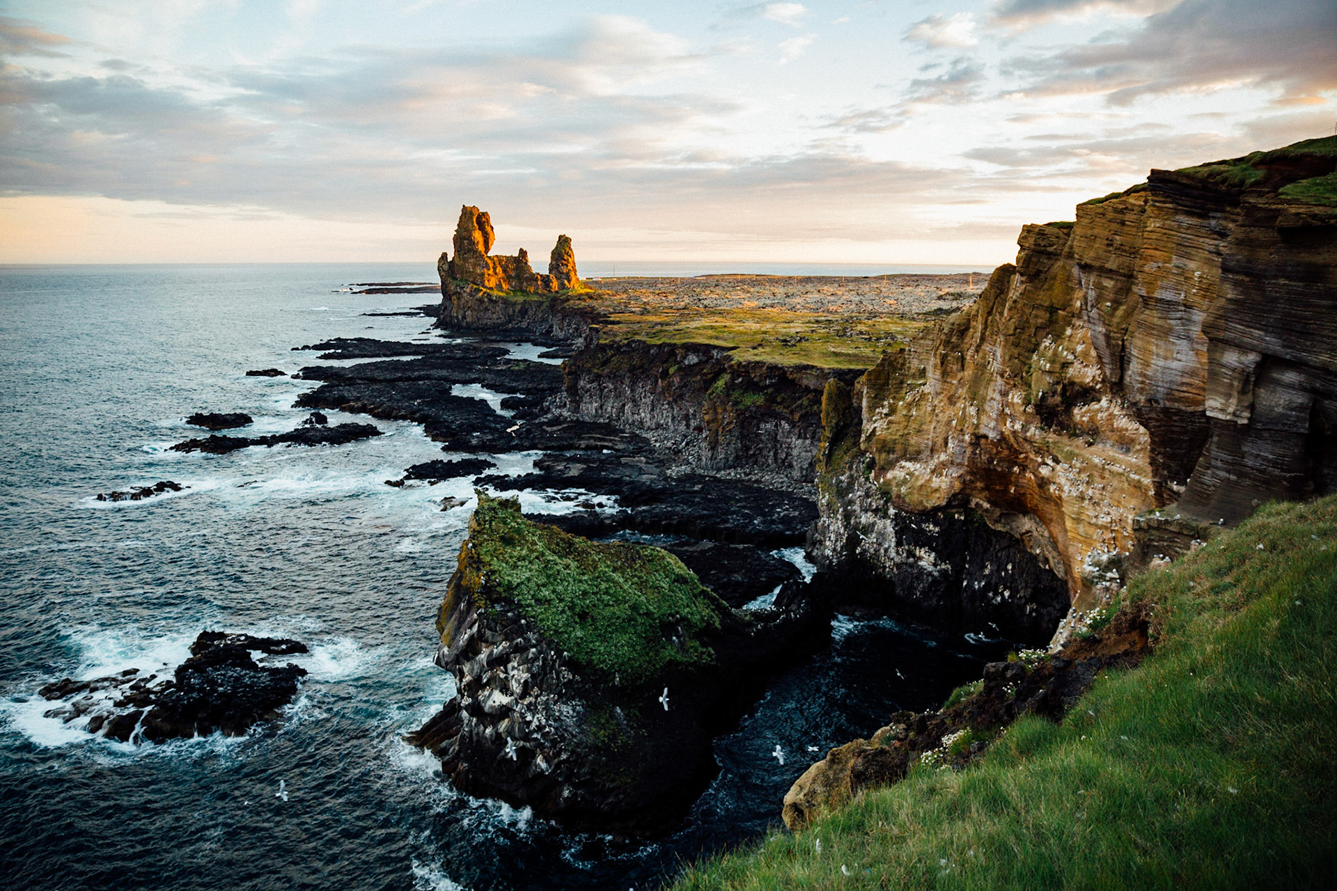 Lóndrangar, Iceland, 2017: The Lóndrangar are a pair of rock pinnacles in Iceland. They are volcanic plugs of basalt, that have been hewn out from softer surrounding rock by erosion.