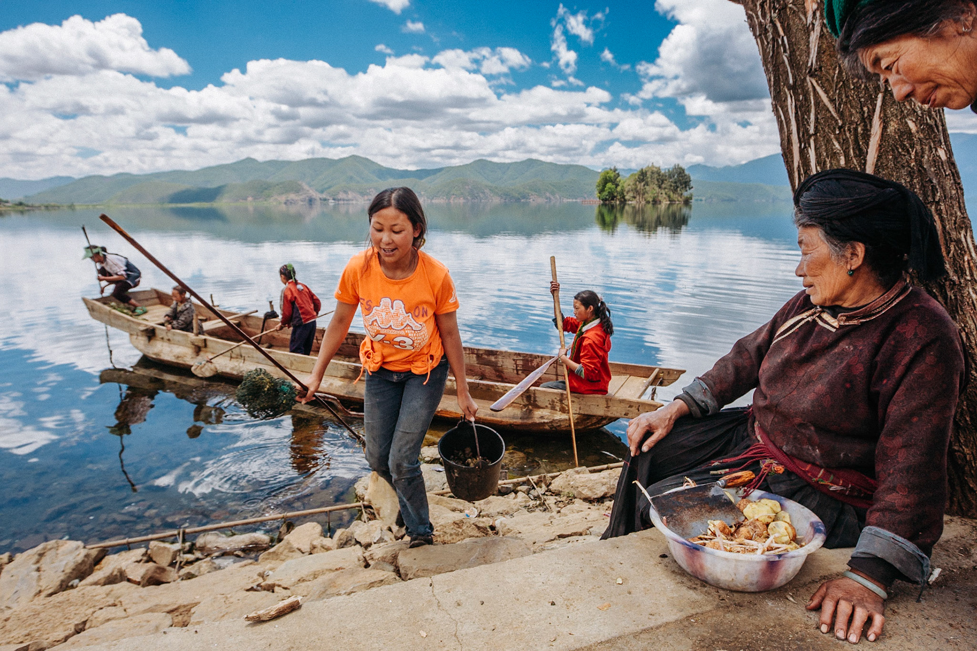 Mosuo women fishing at Lugu Lake, Yanyuan County, Liangshan Yi Autonomous Prefecture, China, Asia, 2008.