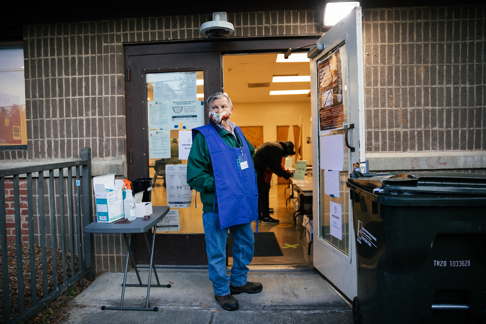 A volunteer waits for voters to arrive to cast their ballots at the W I Patterson Community Center in Durham, North Carolina, USA, 03 November 2020. Americans vote on Election Day to choose between re-electing Donald J. Trump or electing Joe Biden as the 46th President of the United States to serve from 2021 through 2024.