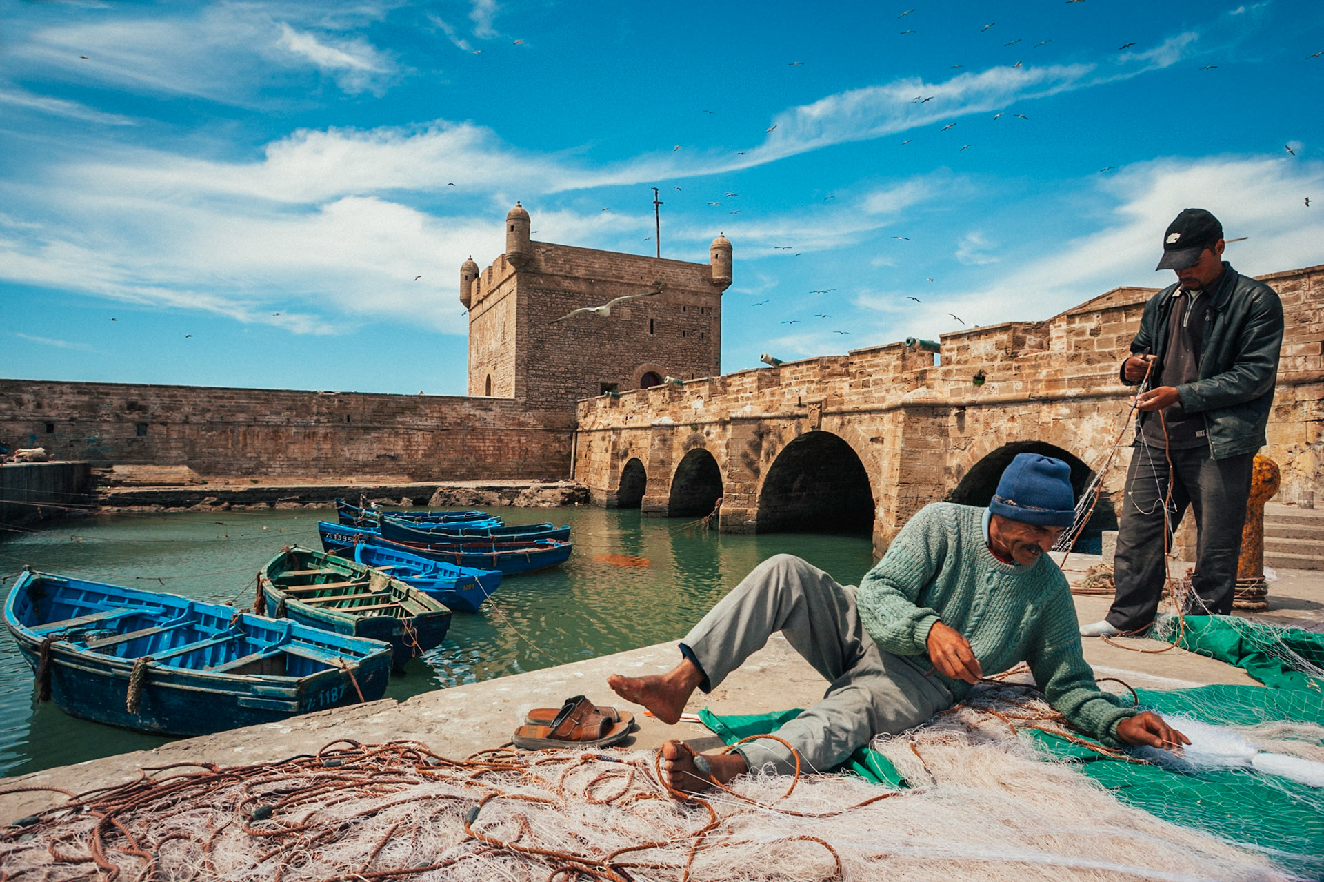 Fishermen working with the fishing net, Essaouira, Marocco, Africa, 2007.