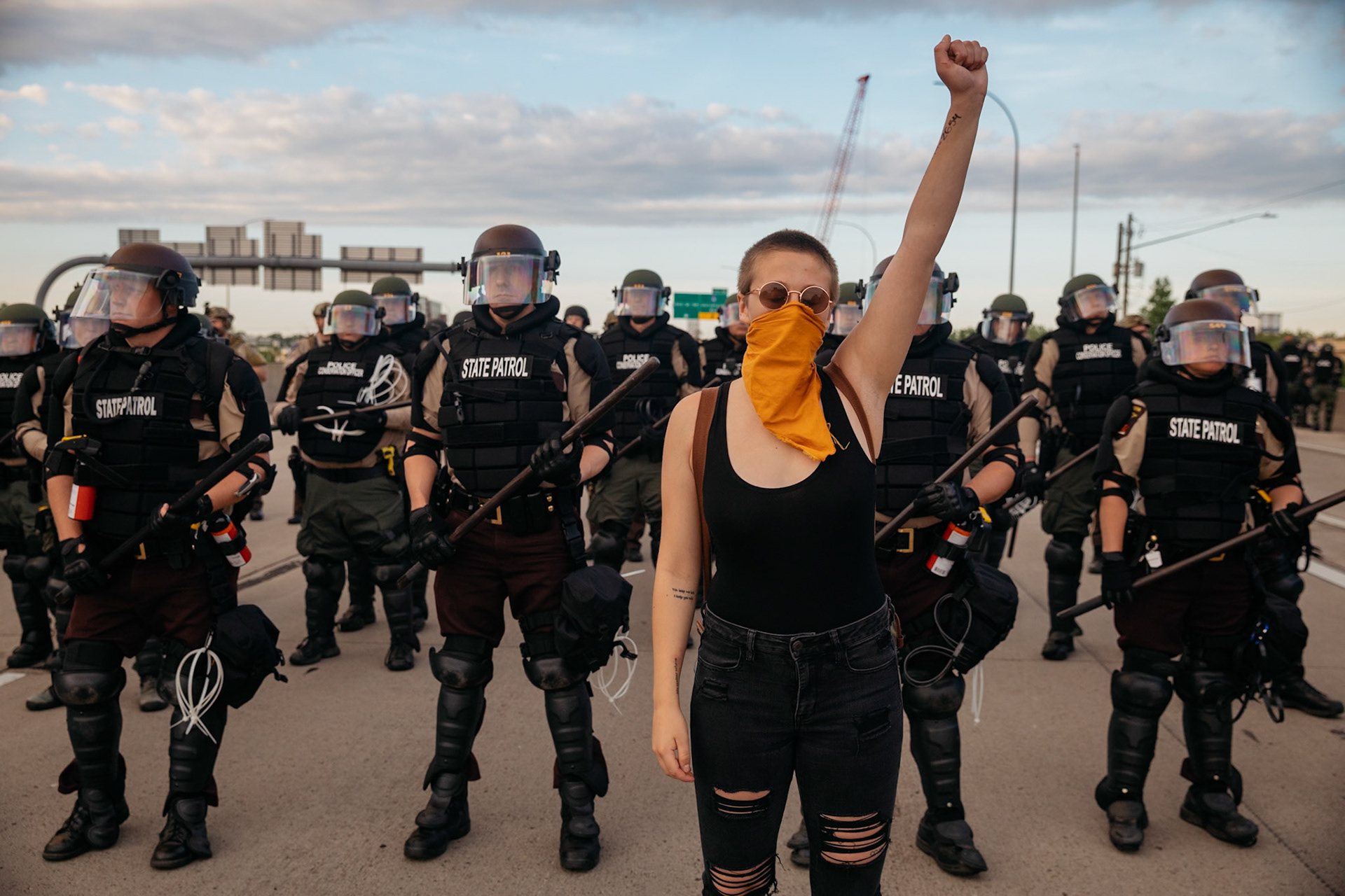 Protestant with raised fist for the murder of George Floyd, Minneapolis, Minnesota, USA. May 31, 2020.