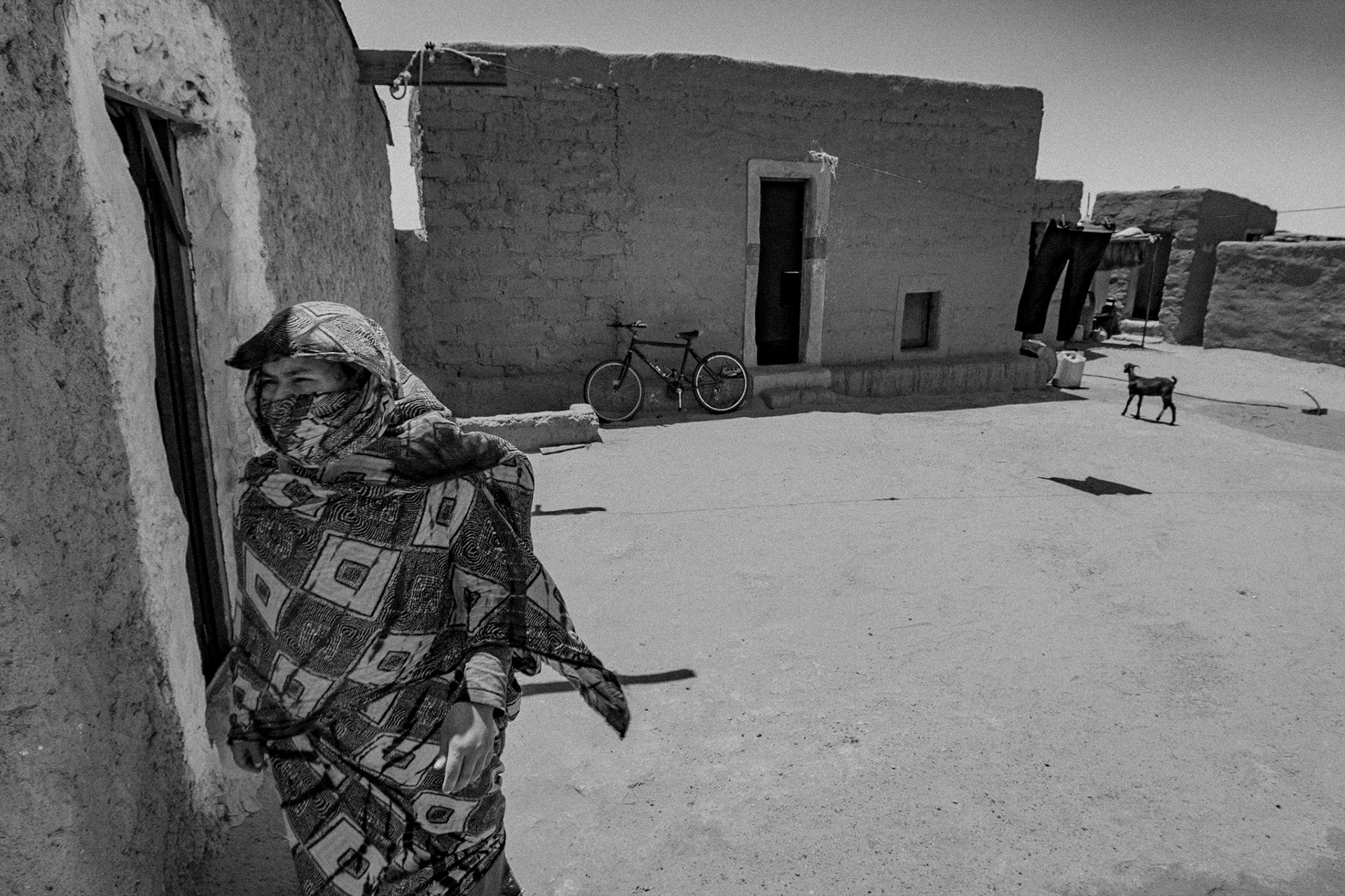 Dakhla refugee camp, Tindouf, Wilaya de Tindouf, Algerian Sahara, 2009: Woman crossing.