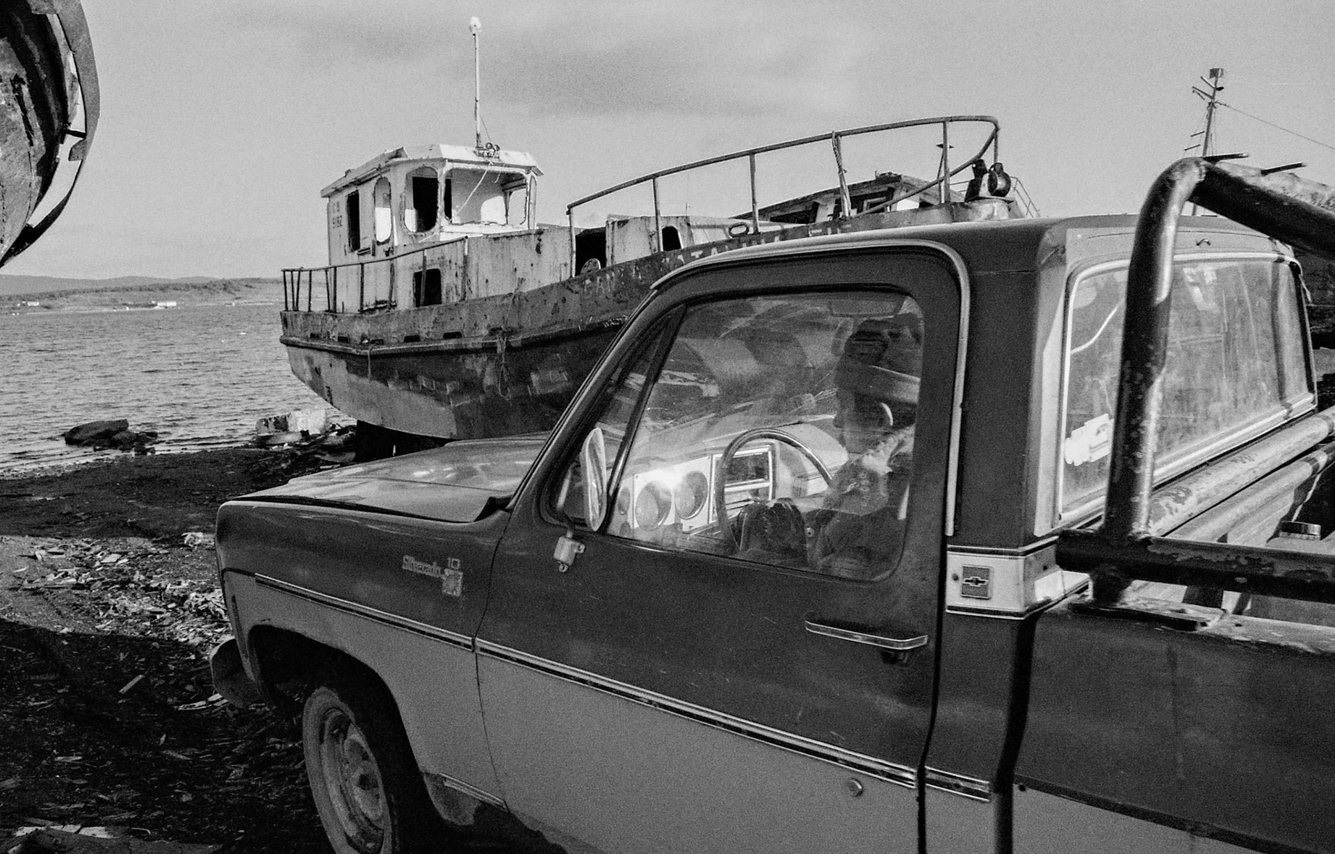 LLUFQUENTUE AREA, IX ARAUCANIA REGION, CHILE - 2004: Man sitting in his car in the vicinity of Lake Villarrica, near Temuco.