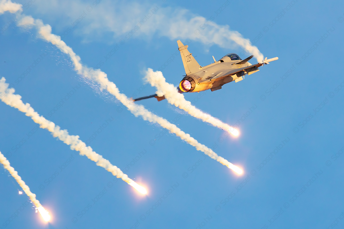 Swedish Air Force SAAB JAS 39C Gripen releasing flares during climb