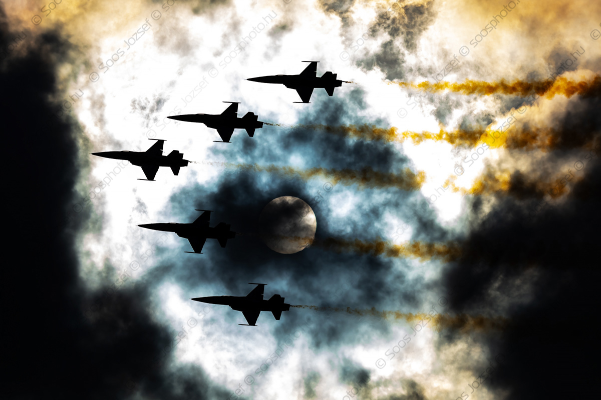 Swiss Air Force Patrouille Suisse display team flying across the sun