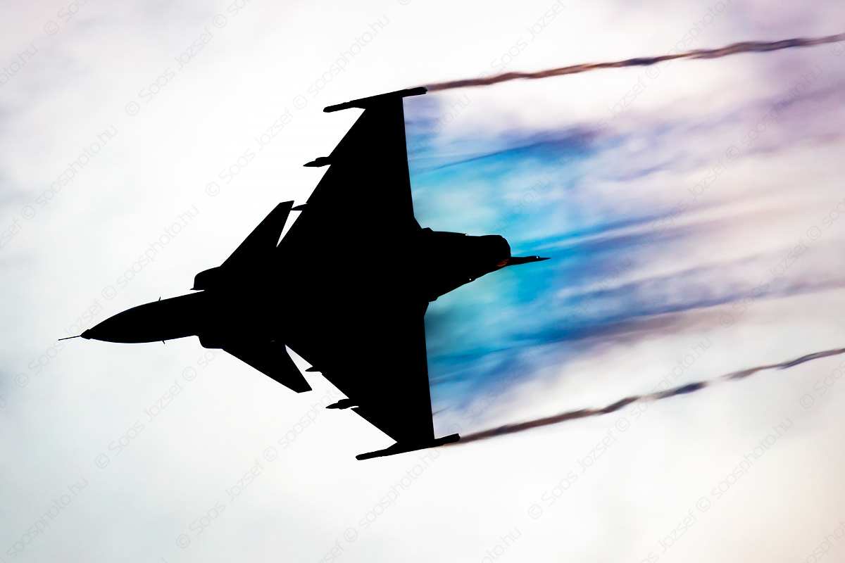 Czech Air Force SAAB JAS 39C Gripen fighter jet in a high-G turn with massive vortex