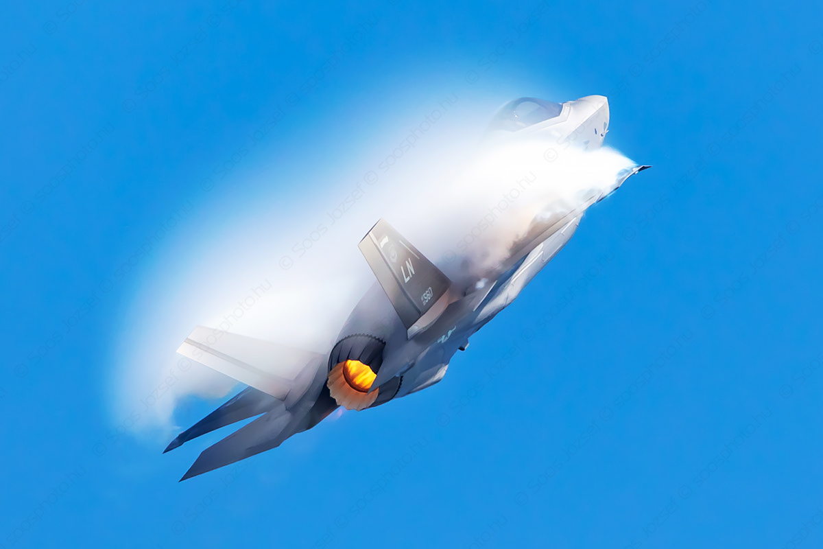 USAF F-35A Lightning II in a high-G climb with heavy vortex generation