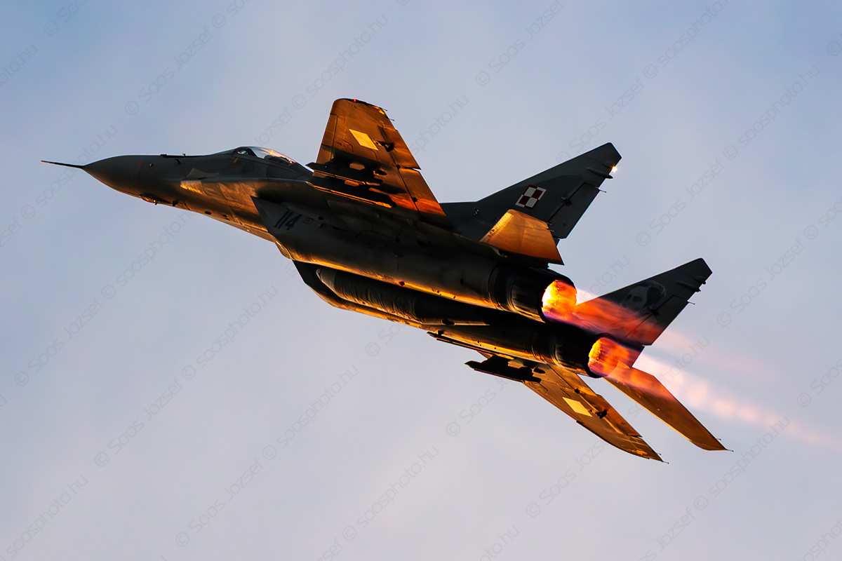 Polish Air Force MiG-29A fighter climbing with full afterburner in twilight