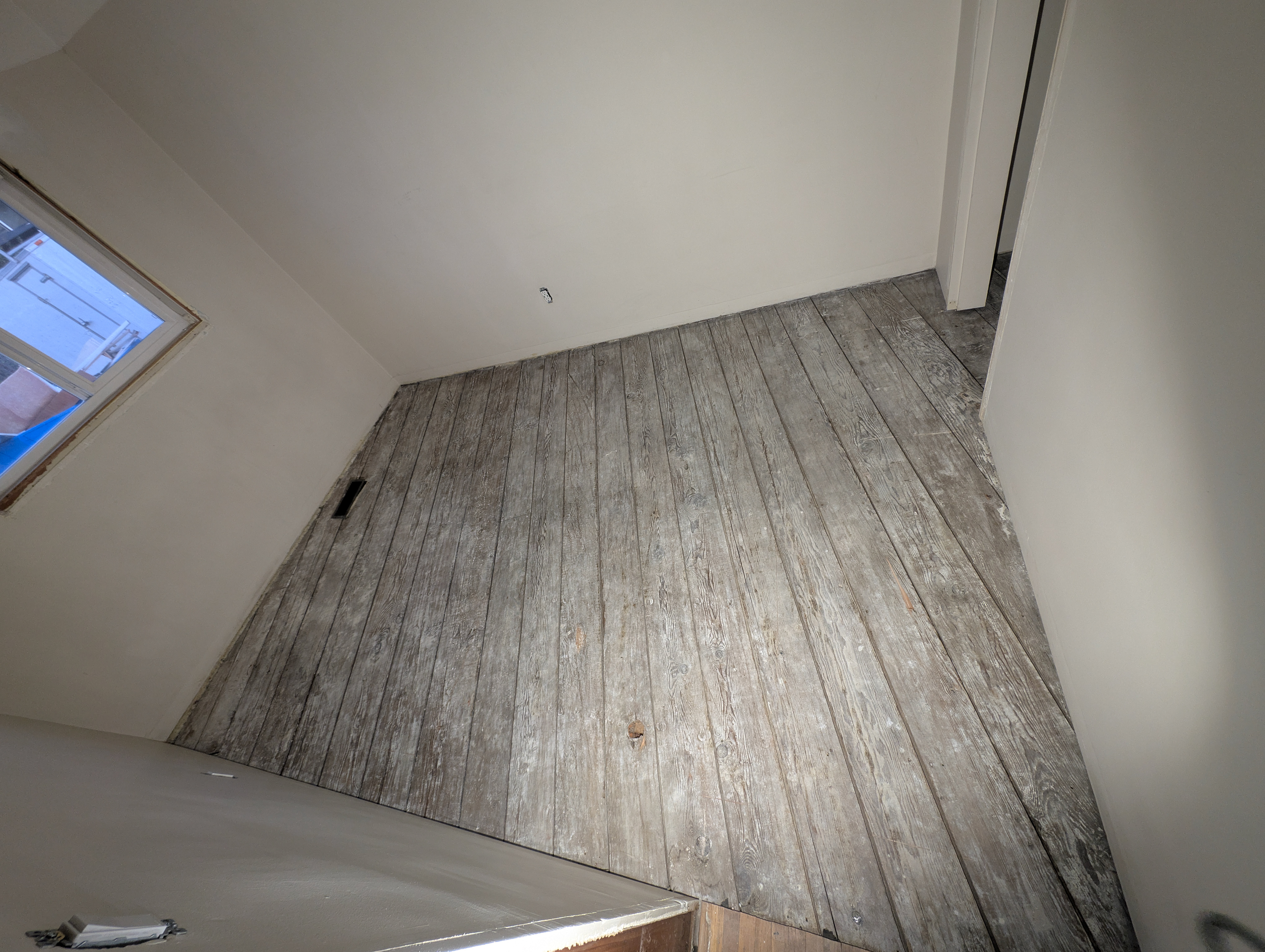 Hand scraping the subfloor