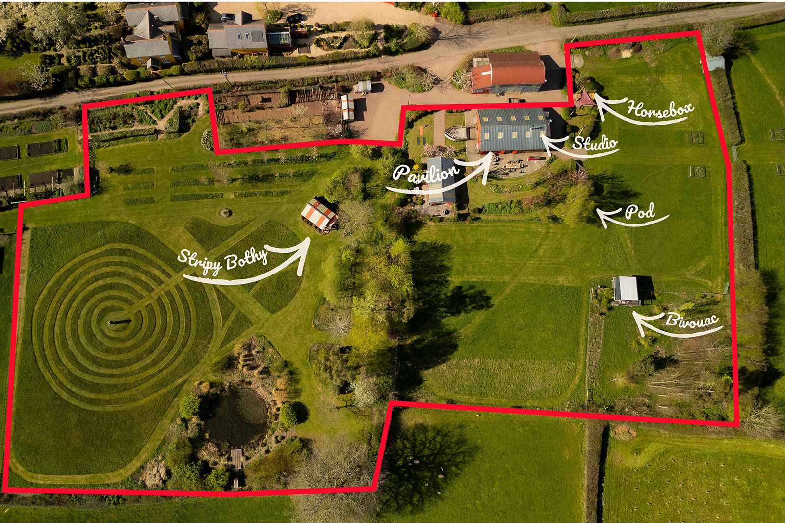 Aerial photography of the group accommodation at Woodlands Farm Wales, with boundaries marked to show the accommodation and outdoor spaces available for group stays.