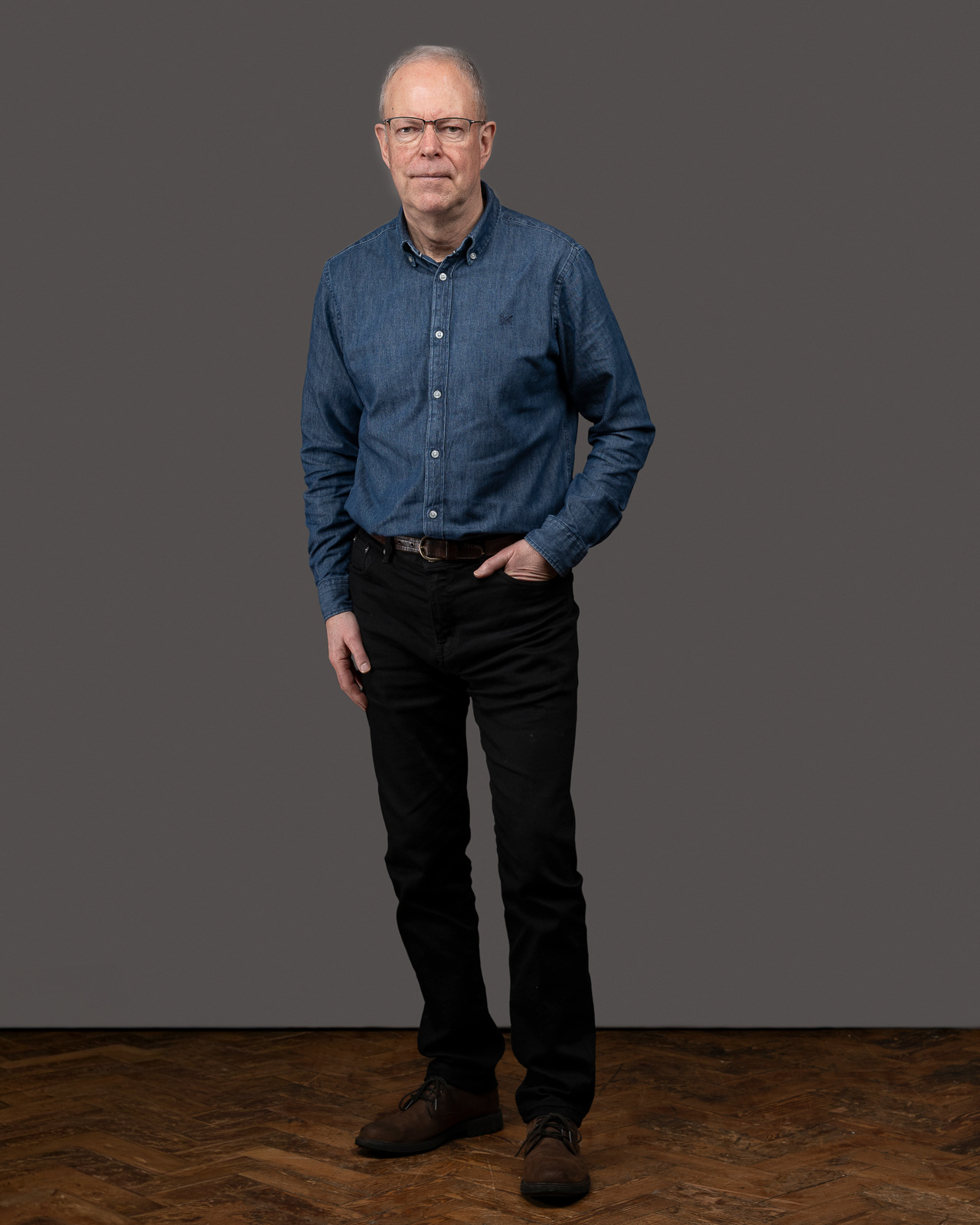 Full-length, standing, neutral backdrop